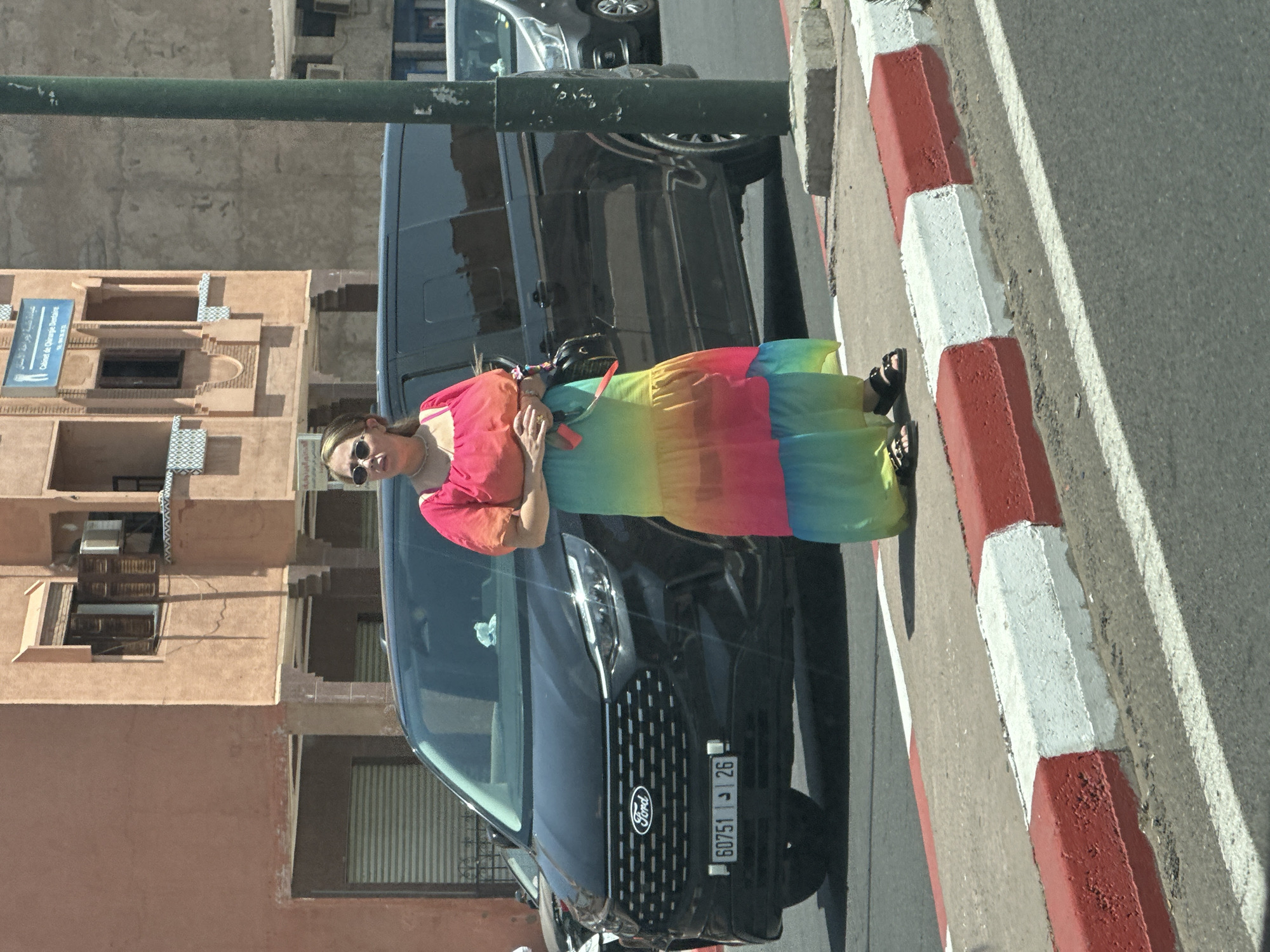 Woman in rainbow dress photographed near disguised cell tower