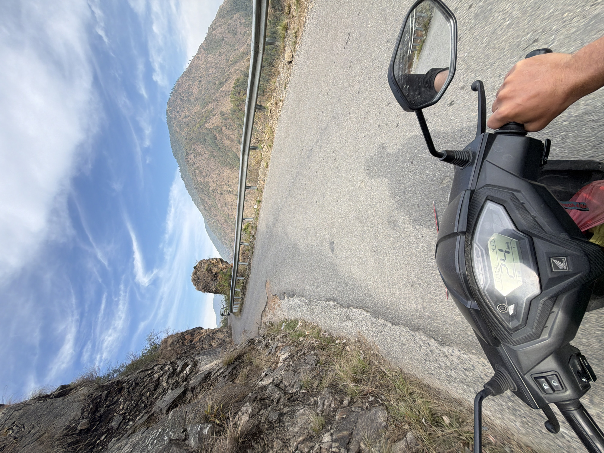 Vehicle travels mountain road in Indrasarowar Nepal