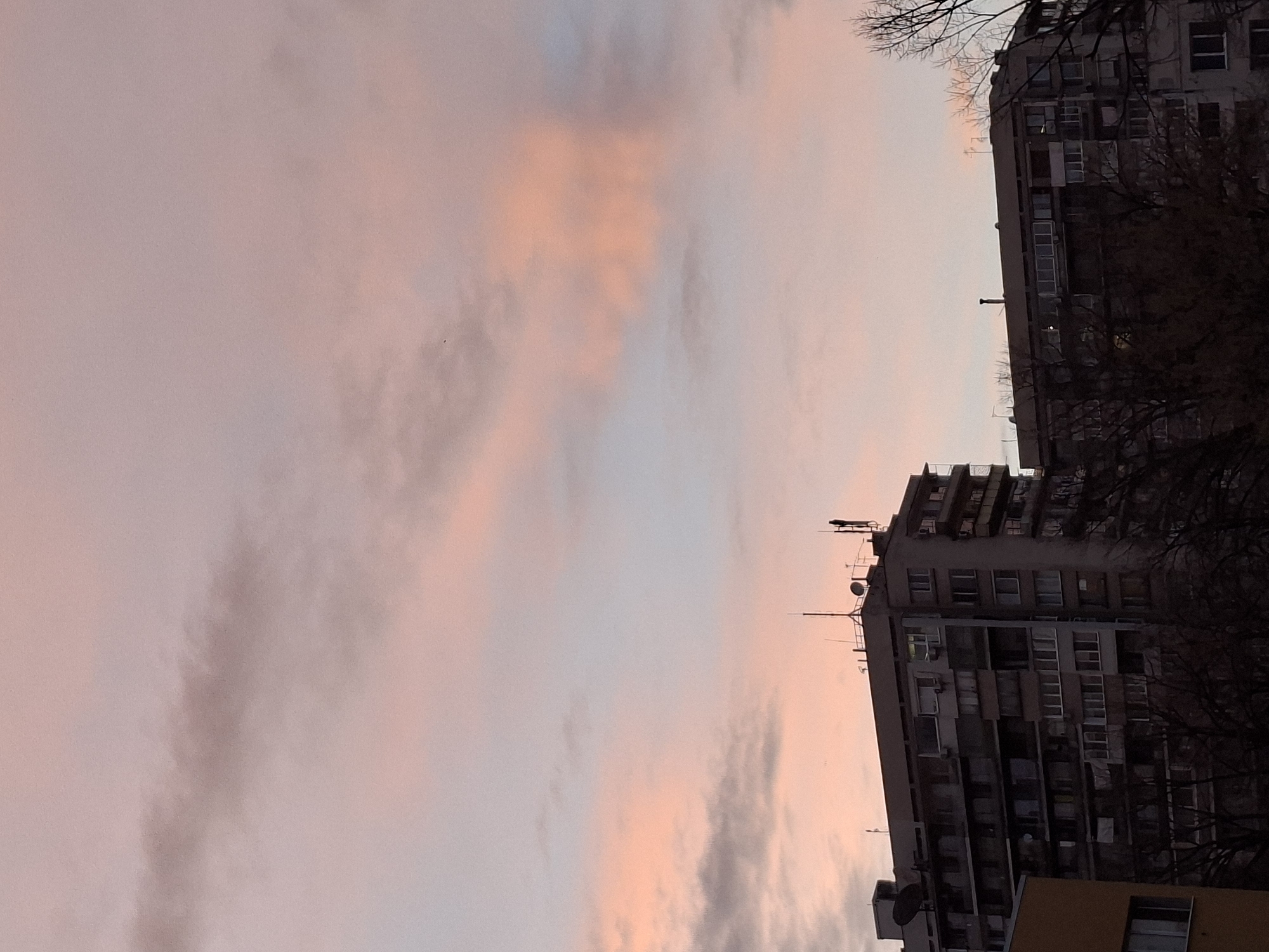 Evening sunset observed over Plovdiv residential buildings and park