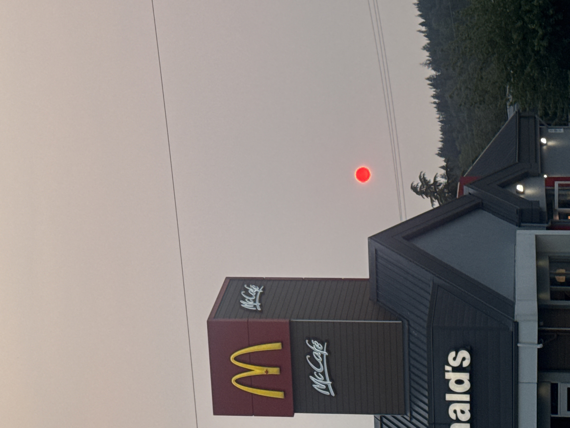 Wildfire smoke turns Coquitlam skies red over urban streets