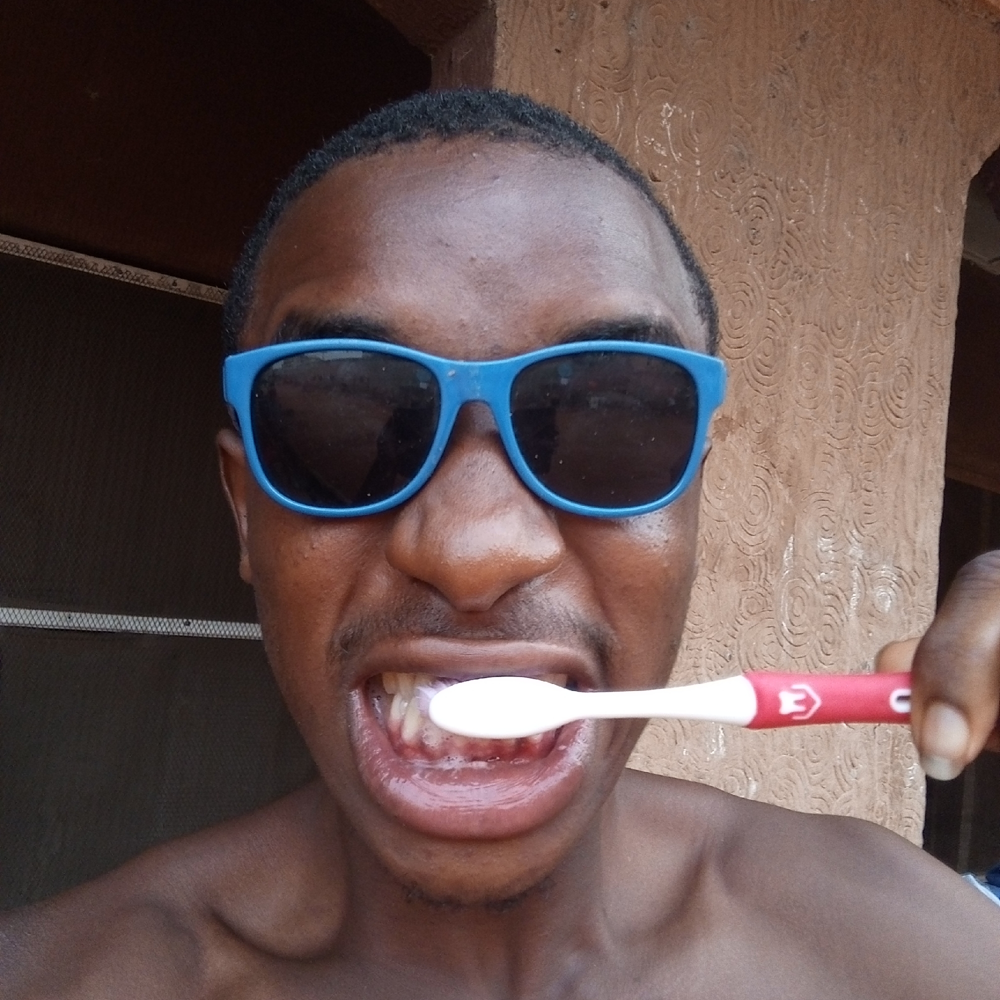 Morning routine captured in outdoor Onitsha setting