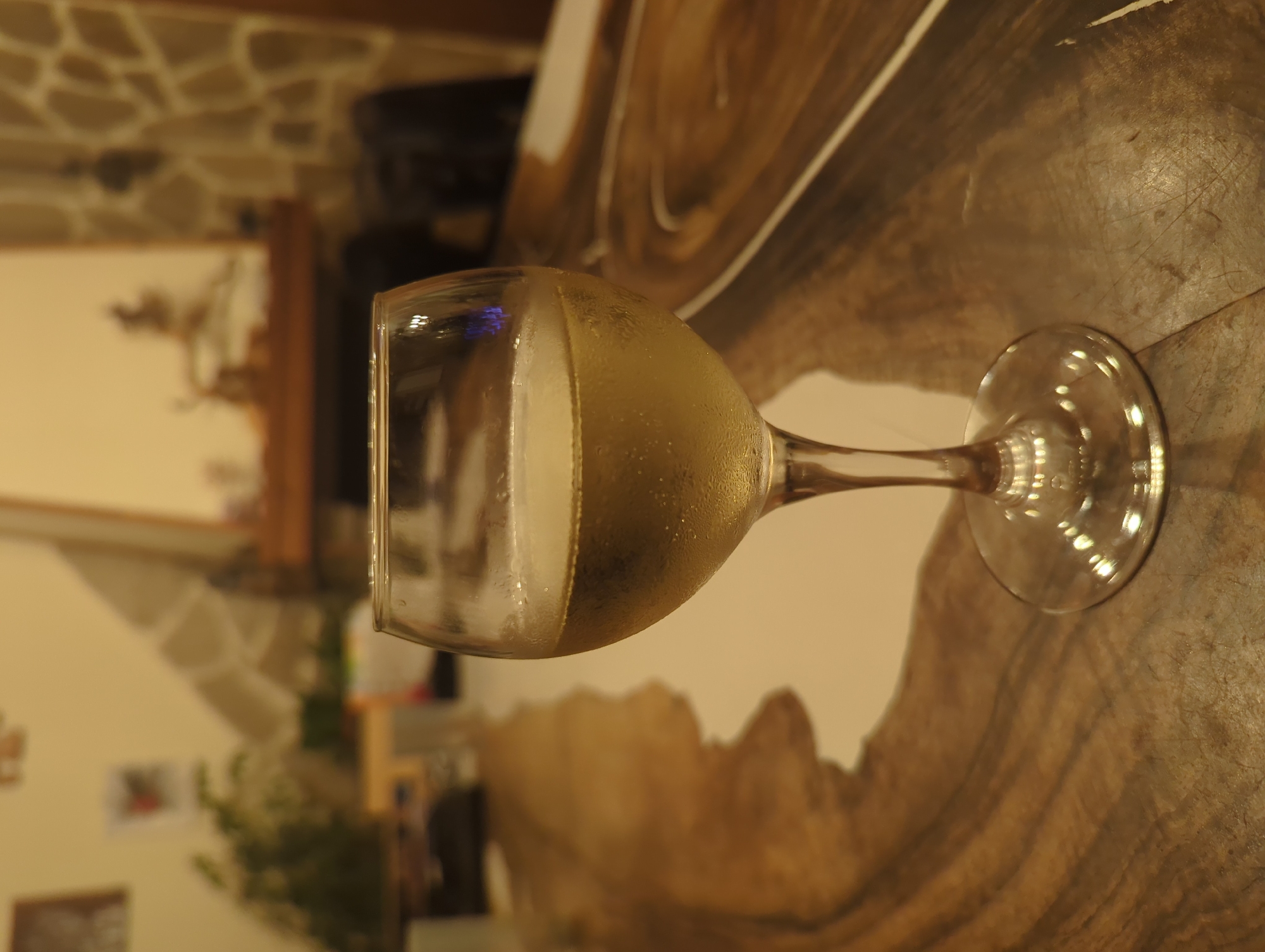 Champagne glass spotted on wooden surface in Septemvri interior