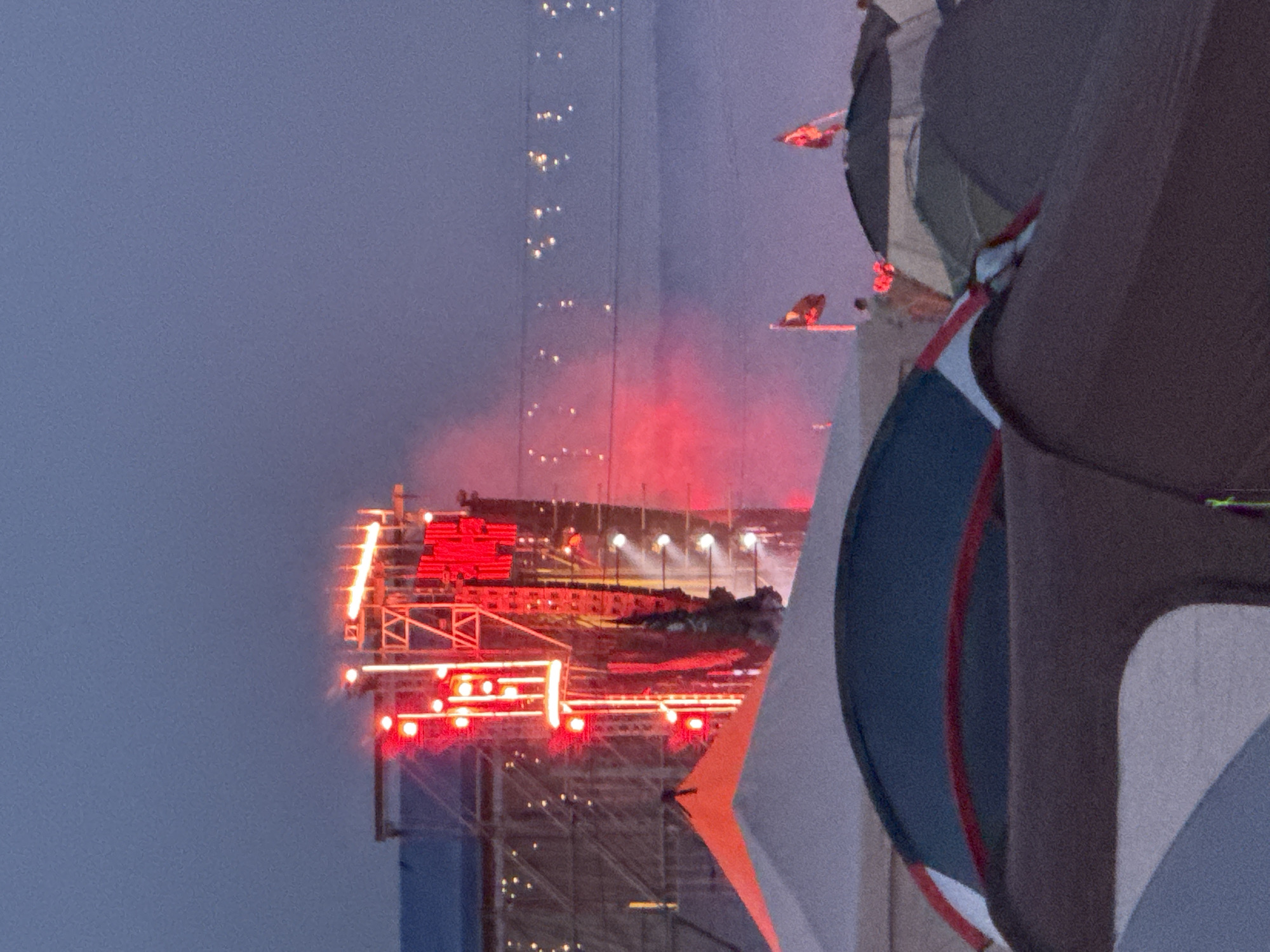 Festival night: live stages, tent city, red lights, and fog