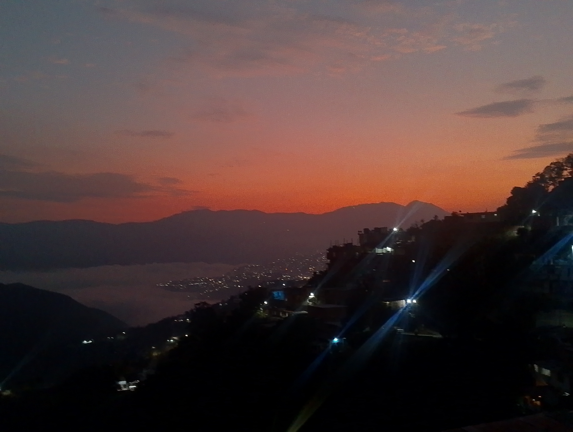 Dawn captured over mountainous Caracas cityscape in Venezuela