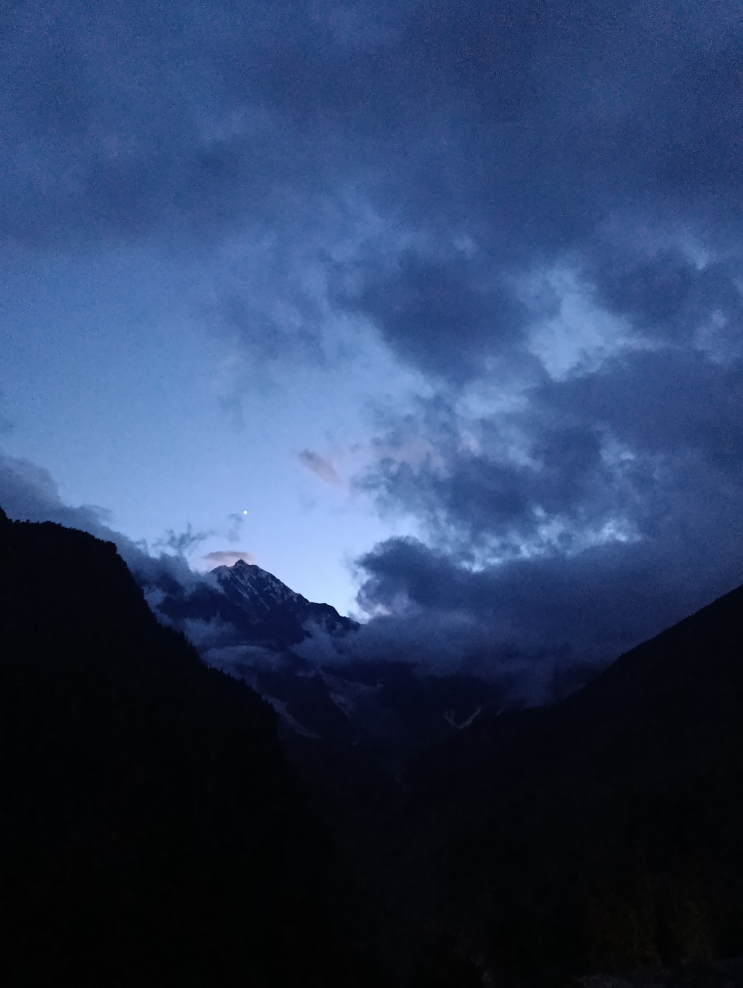 Driving mountain roads at dusk in Burwa, India