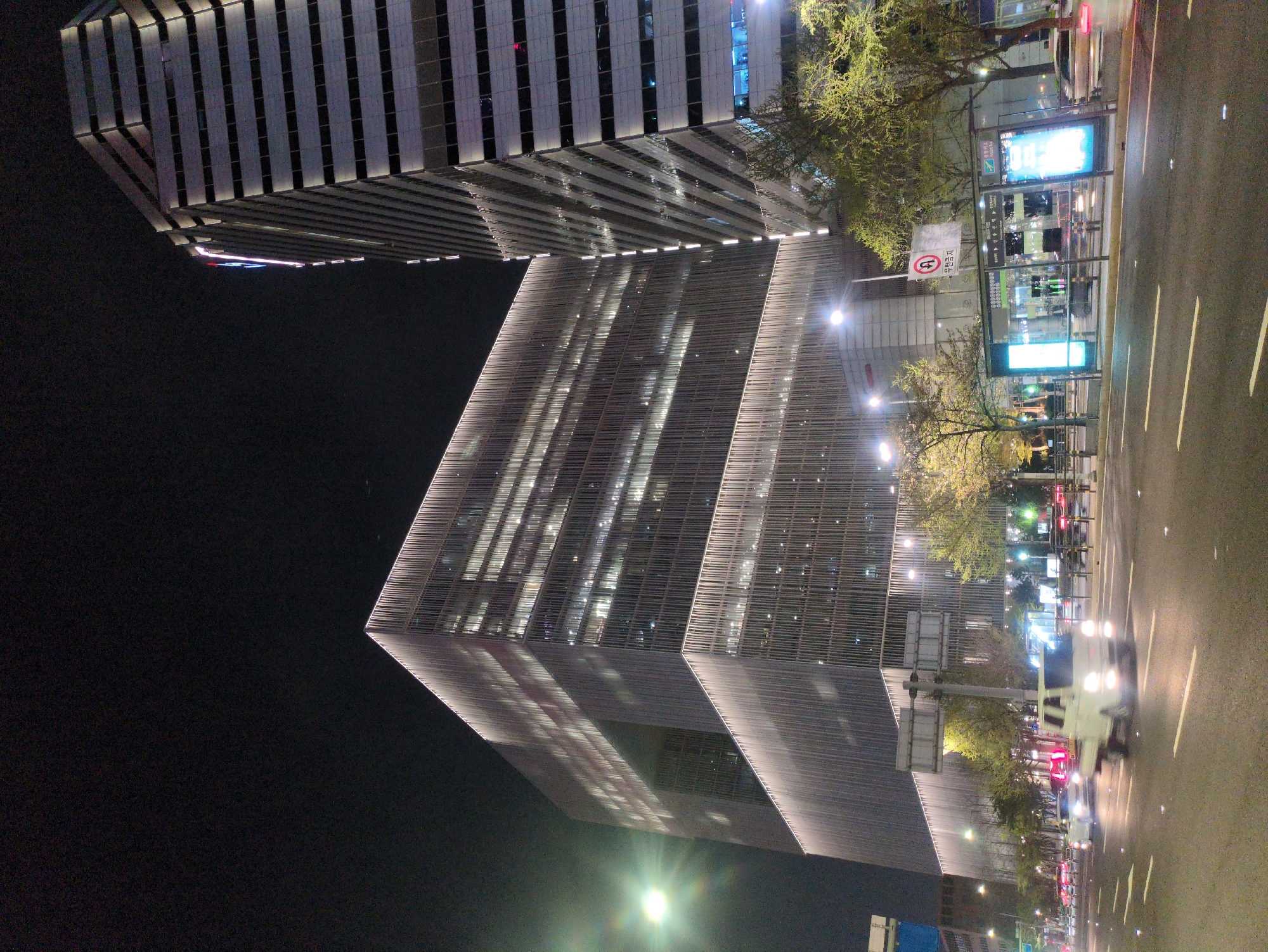 Nighttime Seoul scenes captured: highway traffic, Trump World building, subway