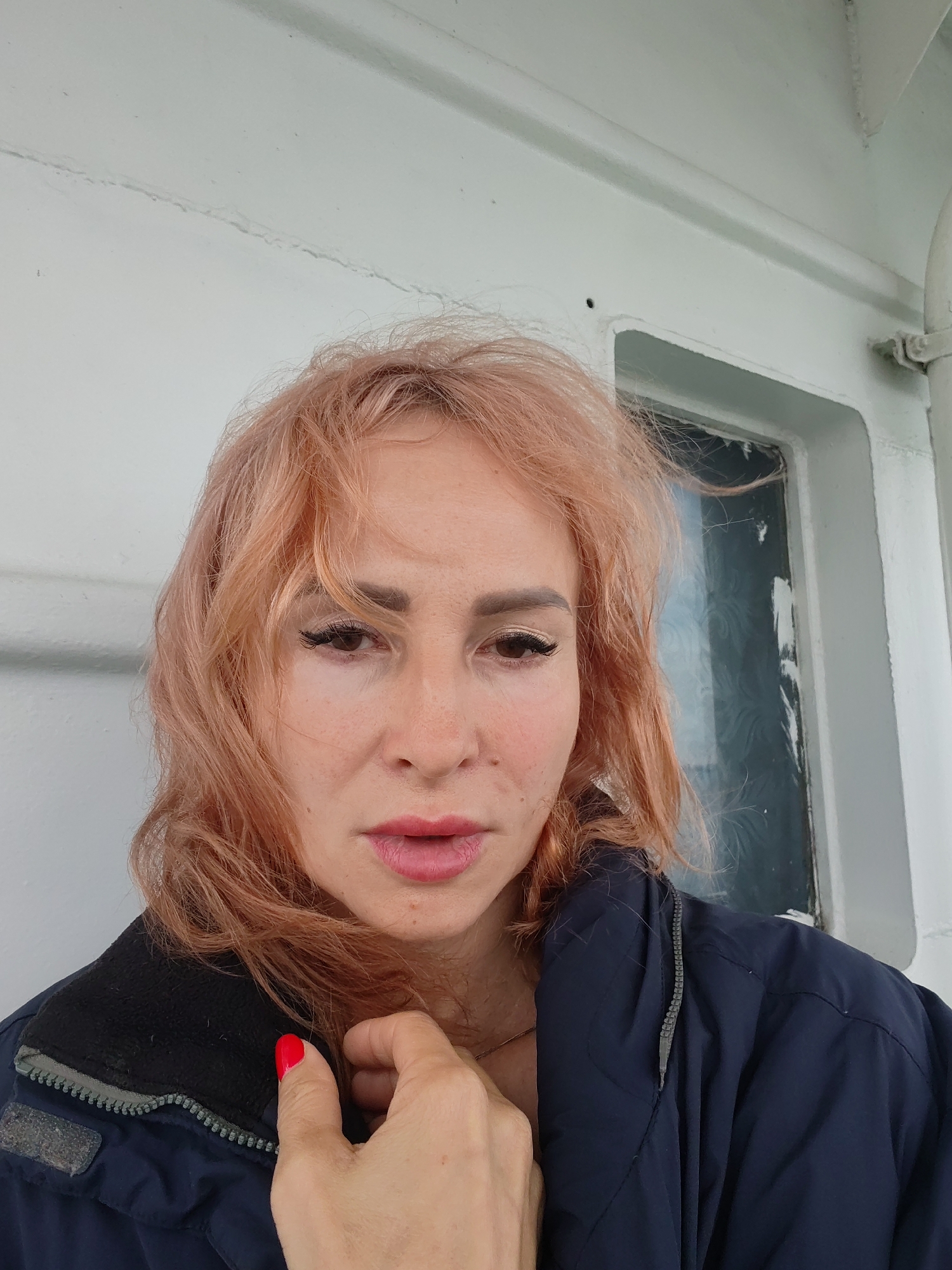 Selfies and a quiet riverside scene on a cloudy day