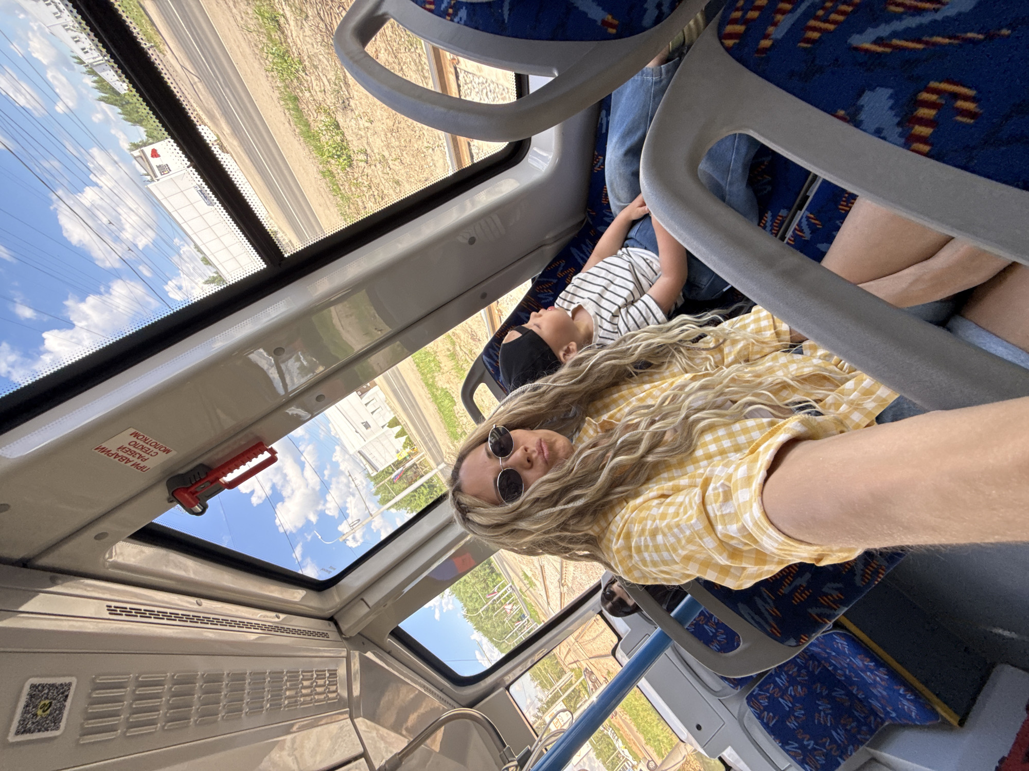 Woman and child travel by bus in rural Russia