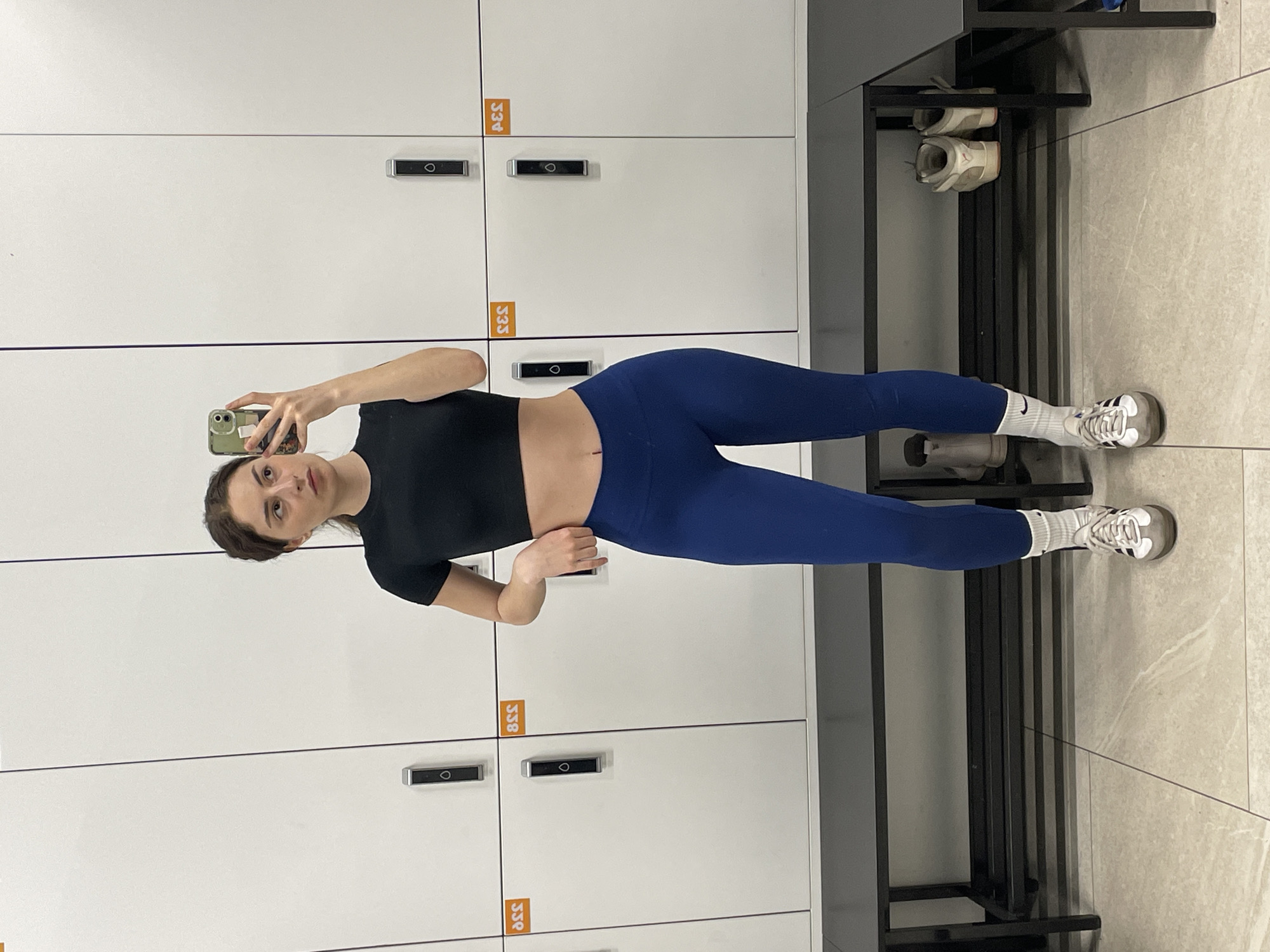 Woman takes selfies in Moscow gym locker room