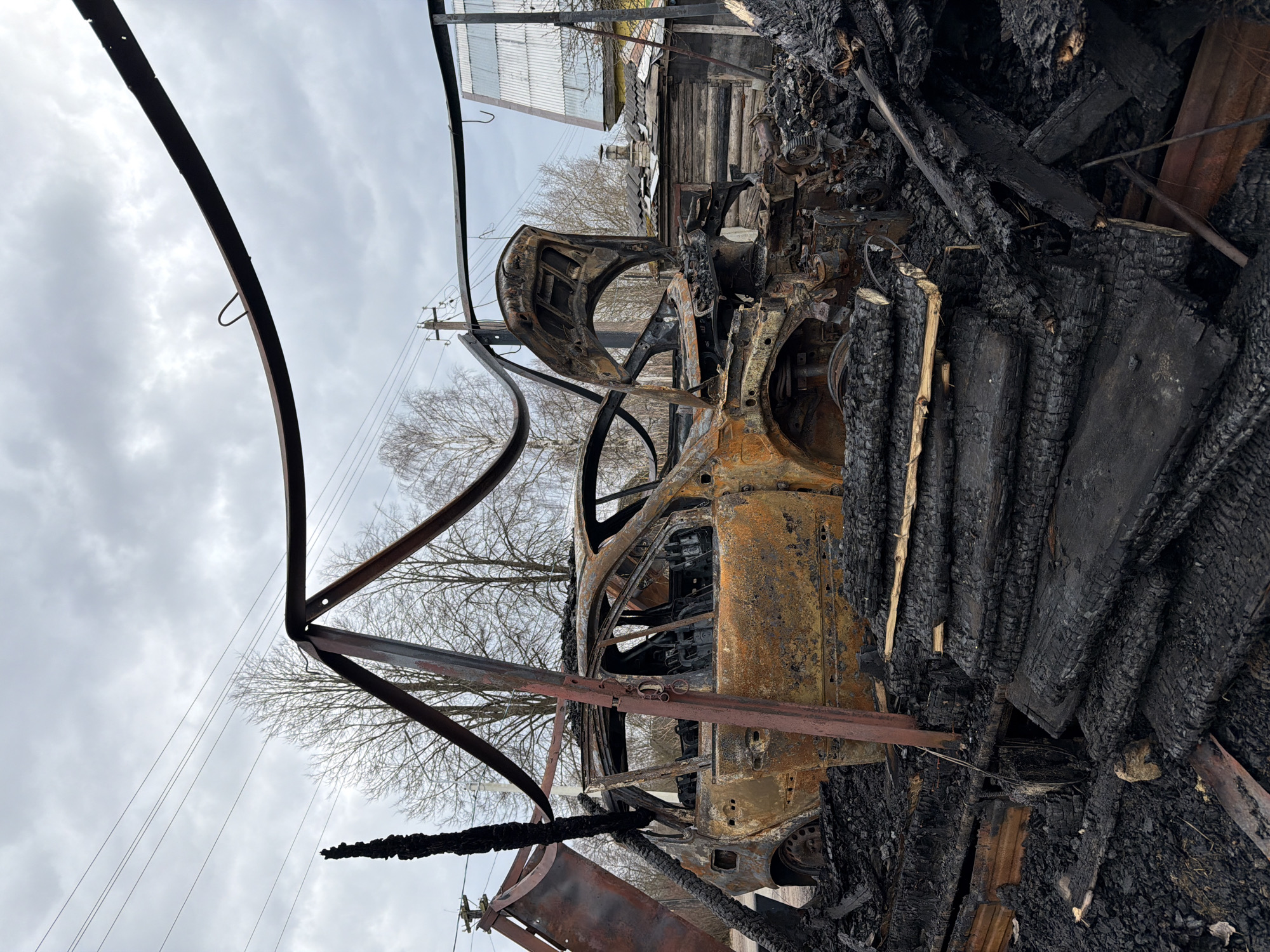Vehicle fire aftermath and stork activity documented in rural Russia