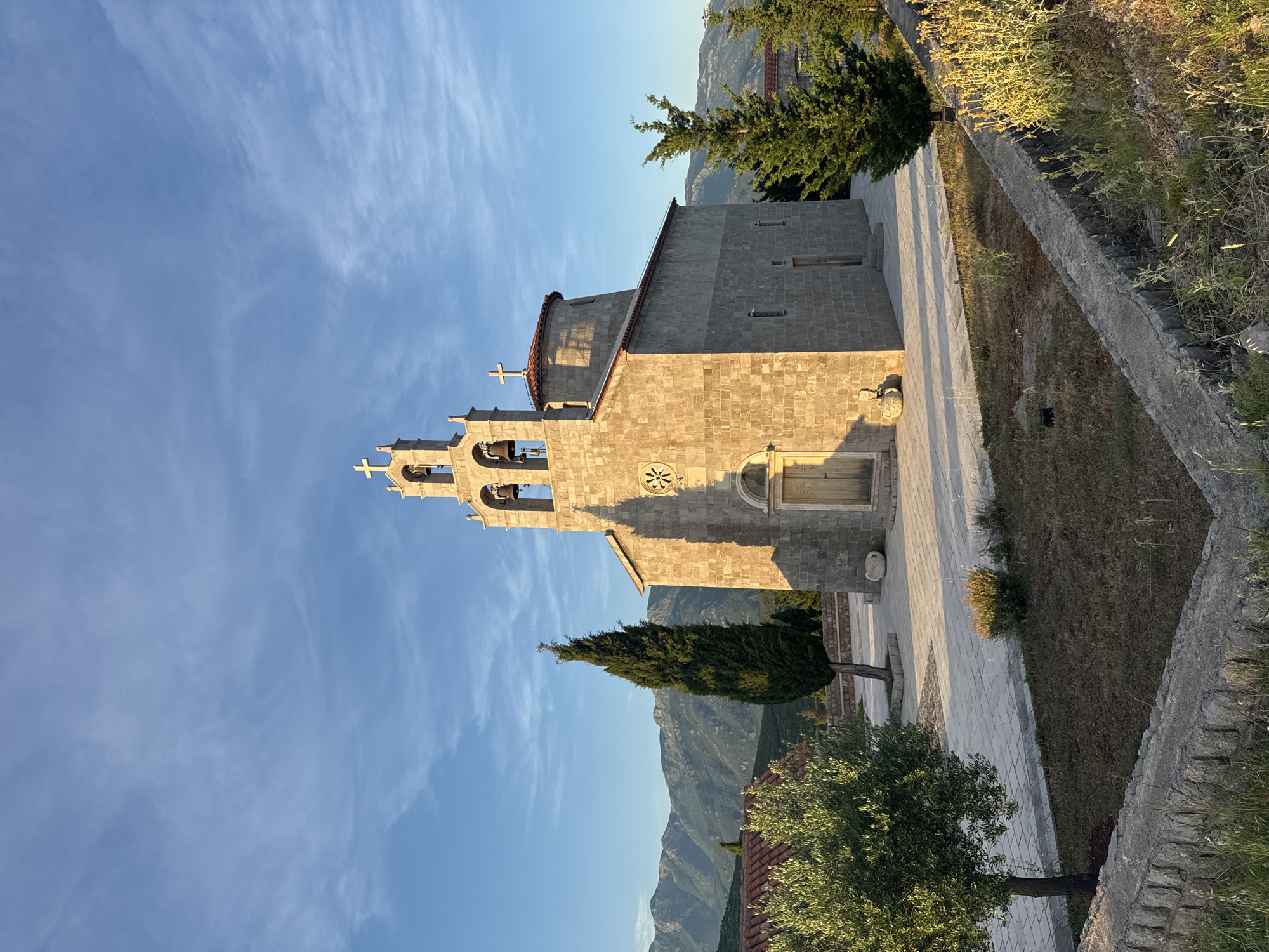 Sunset over Kovačko Polje — churches, coast, and close-up ground life