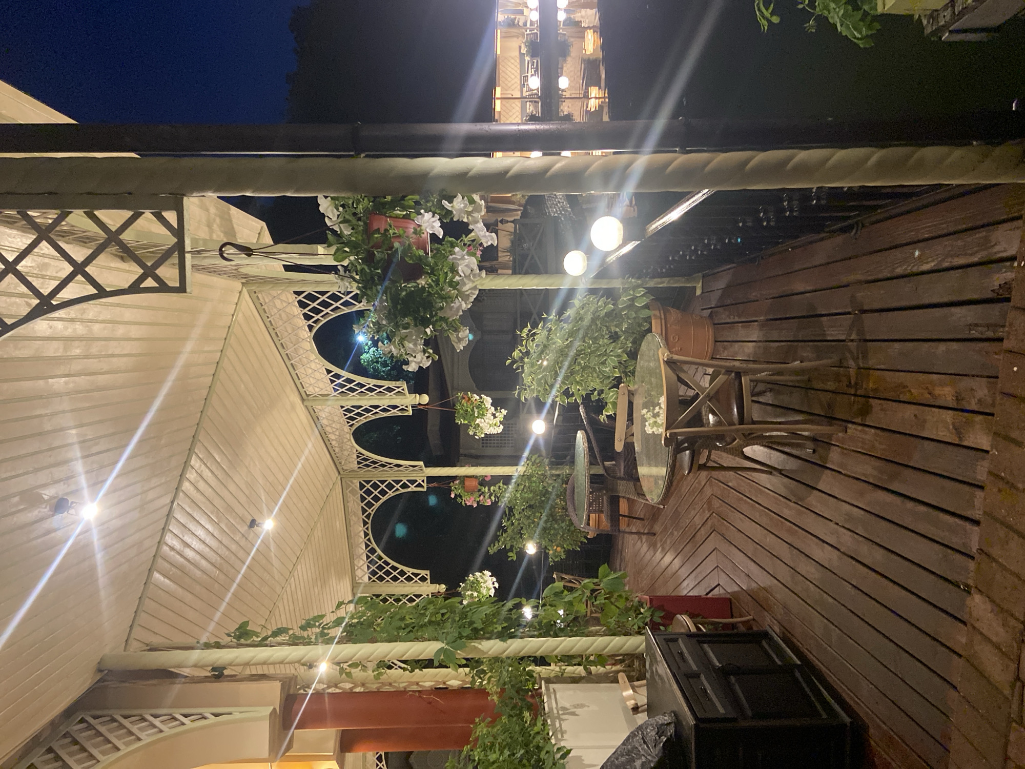 Night out at a lit waterfront cafe in Ufa