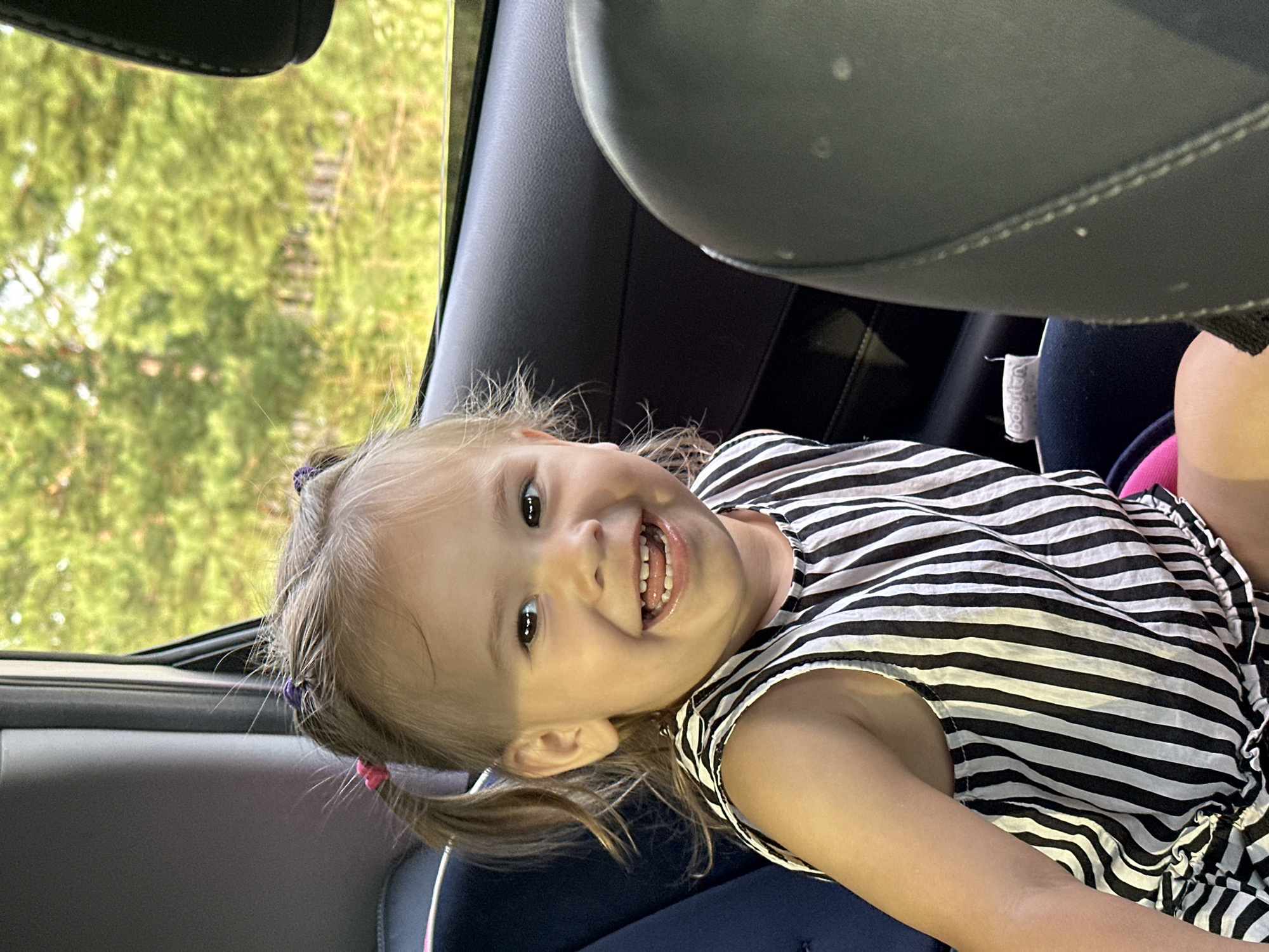 Cheerful backseat moment on a summer drive in rural Russia