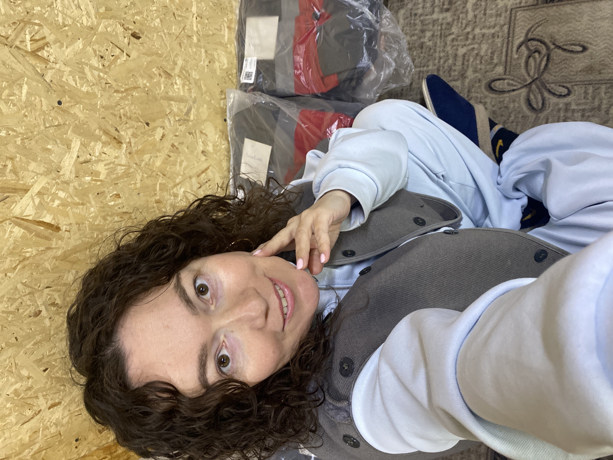 Woman relaxing indoors with pen and mug in Ol'khovskoye