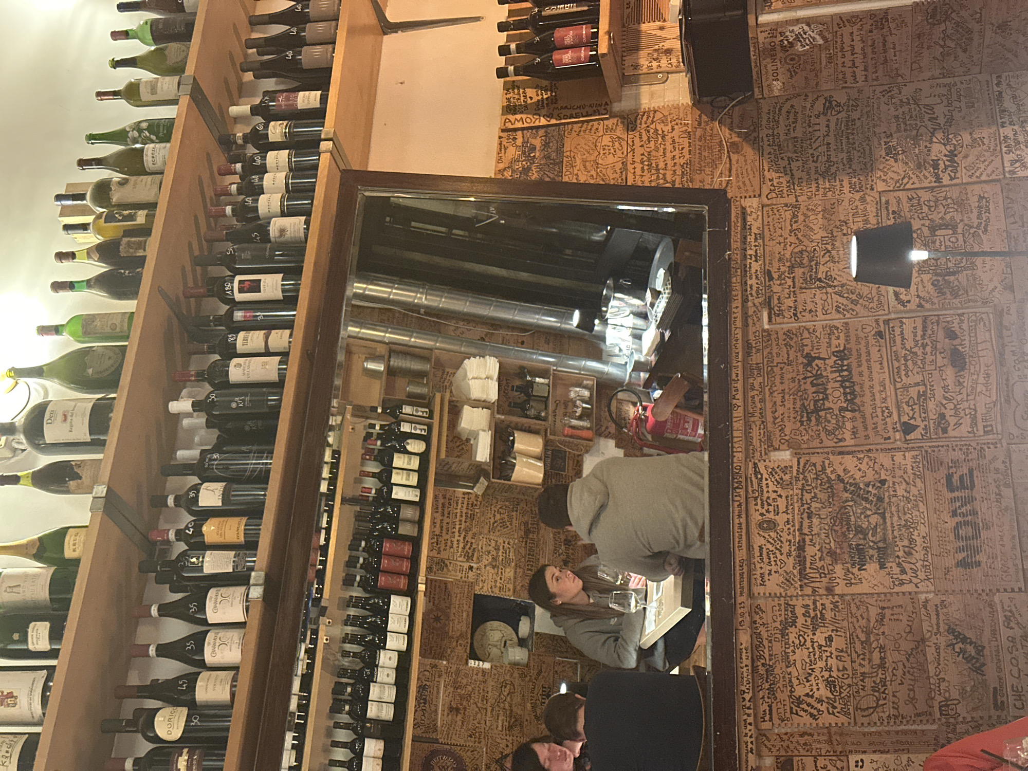 Traditional Roman restaurant with handwritten wall art documented