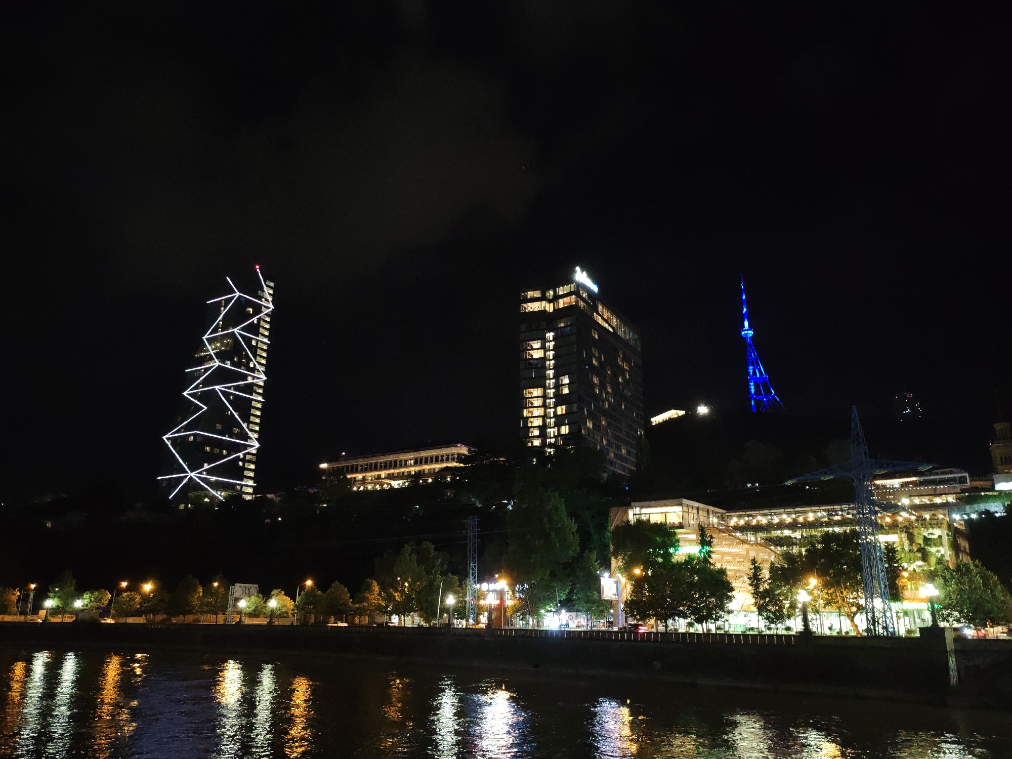 Tbilisi riverfront at night, landmarks and streets.