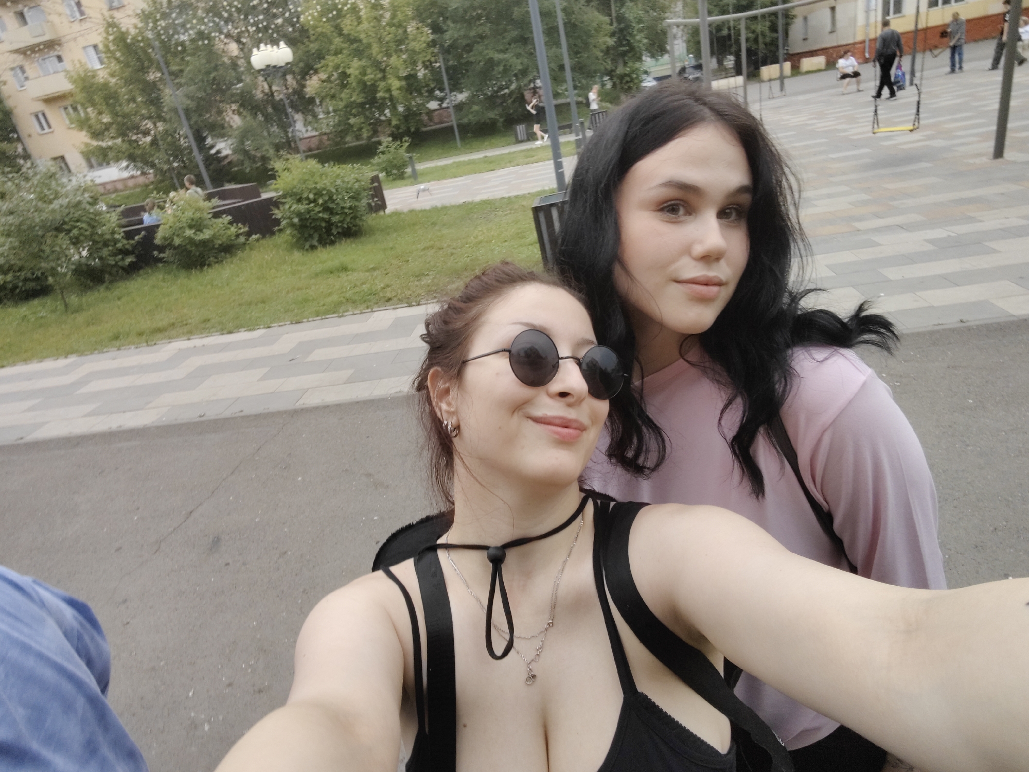 Afternoon hangout on a Krasnoyarsk walkway, July 2026