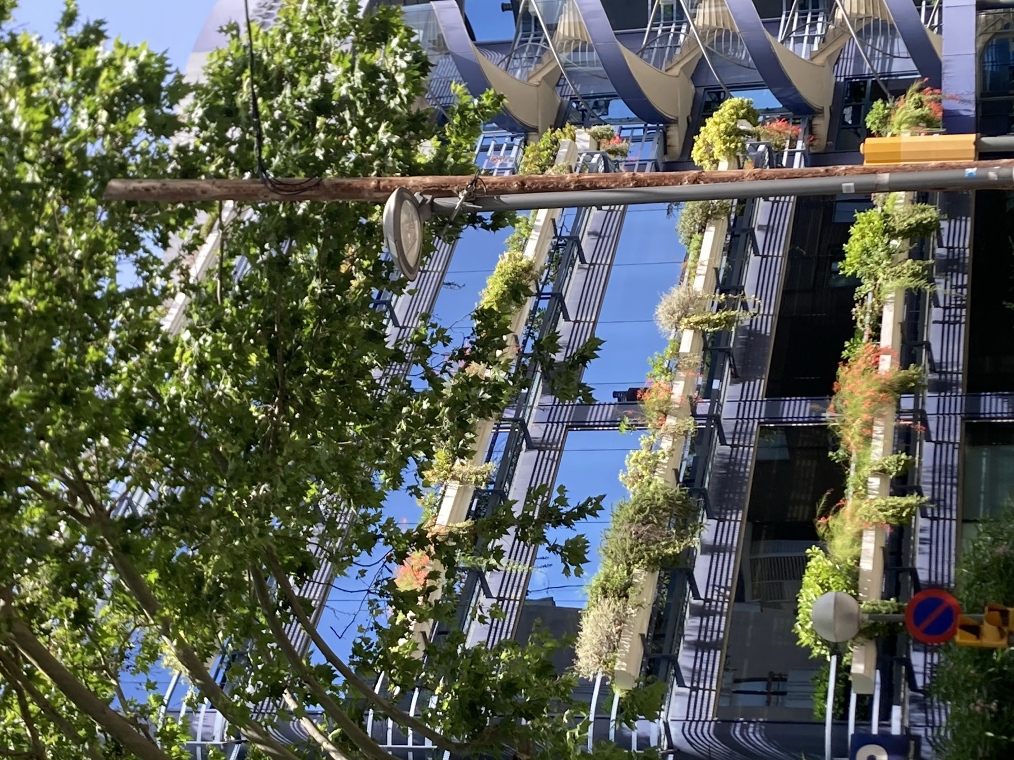 Barcelona office building with spiral staircase and vertical gardens