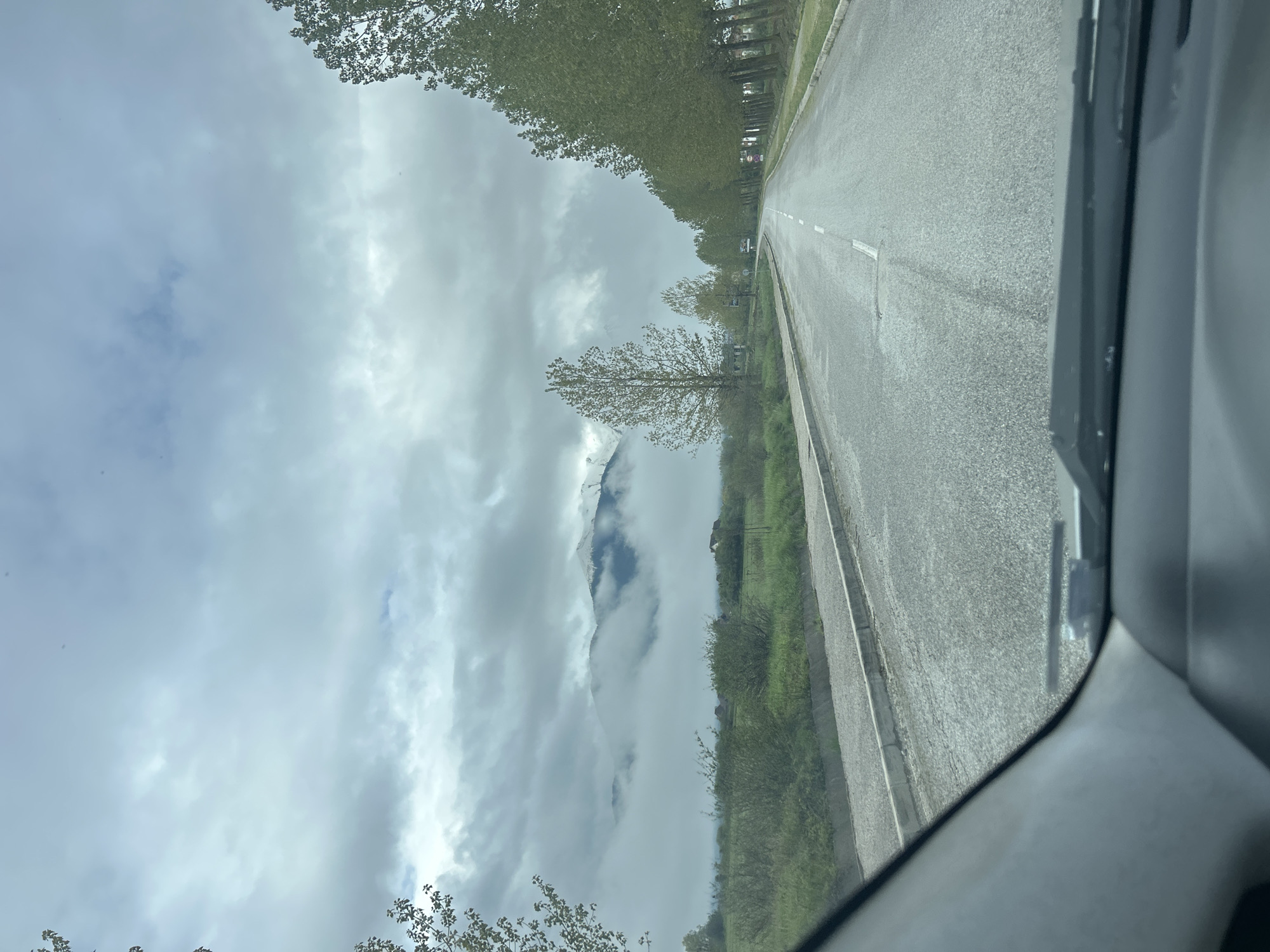 Morning drive captured on tree-lined road in Razlog, Bulgaria