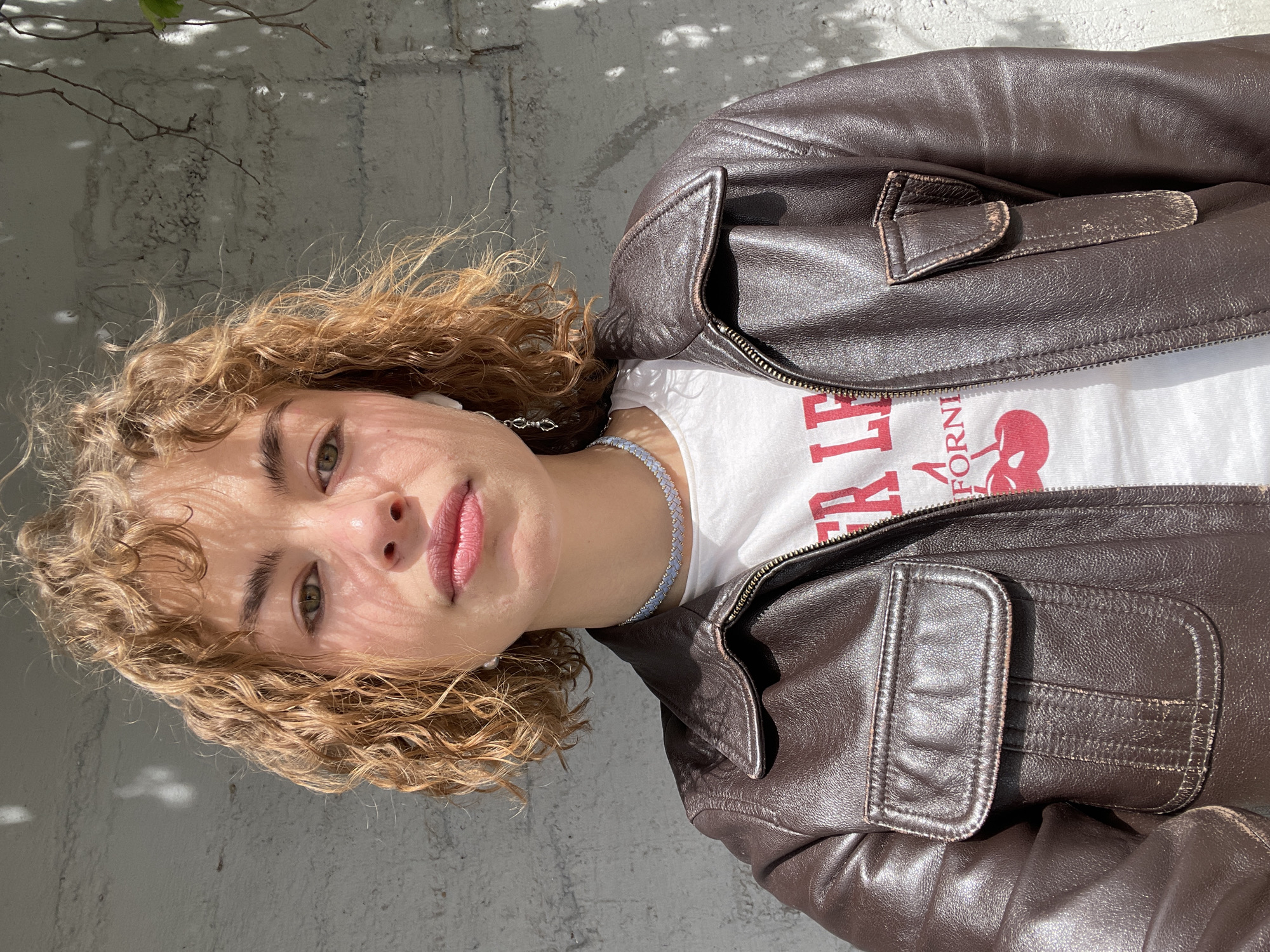 Woman in leather jacket photographed multiple times in Montenegro