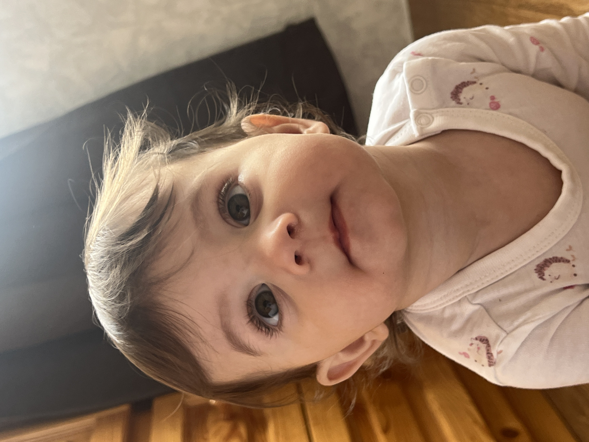 Baby photographed in white patterned shirt in Elena, Bulgaria