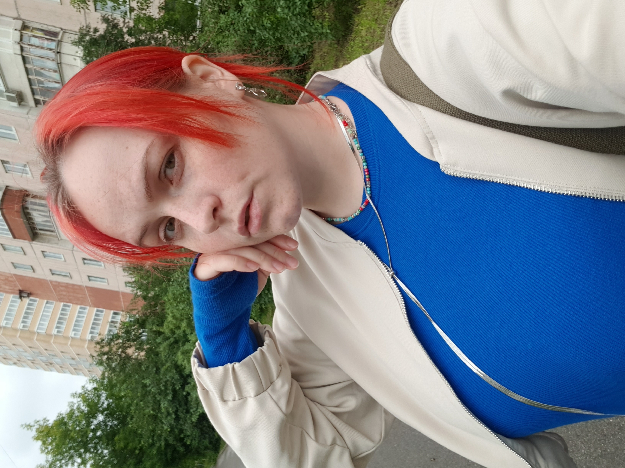 Two quick portraits, red hair, neutral look, outdoors