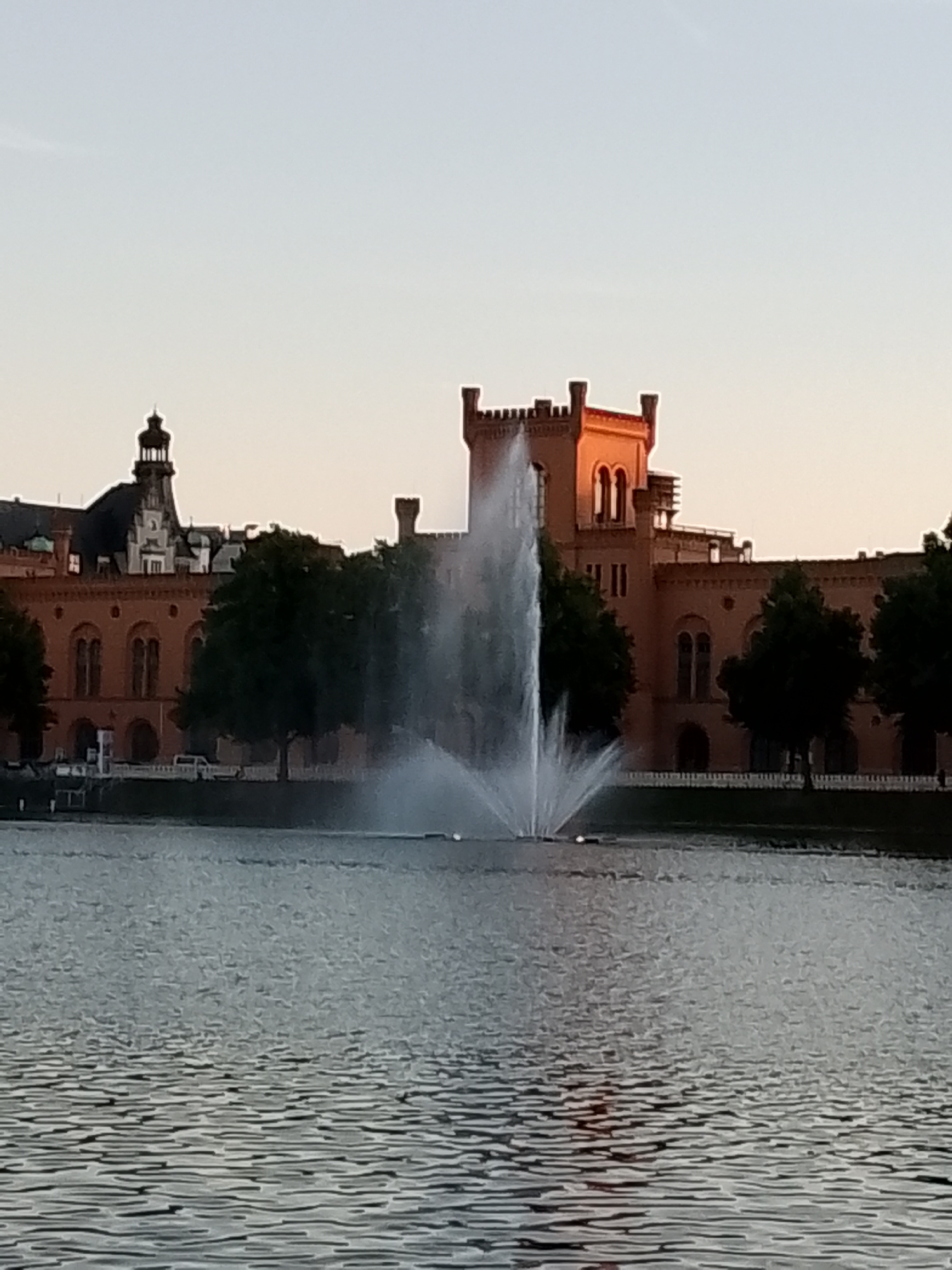 Exploring Schwerin's lakeside city center at golden hour