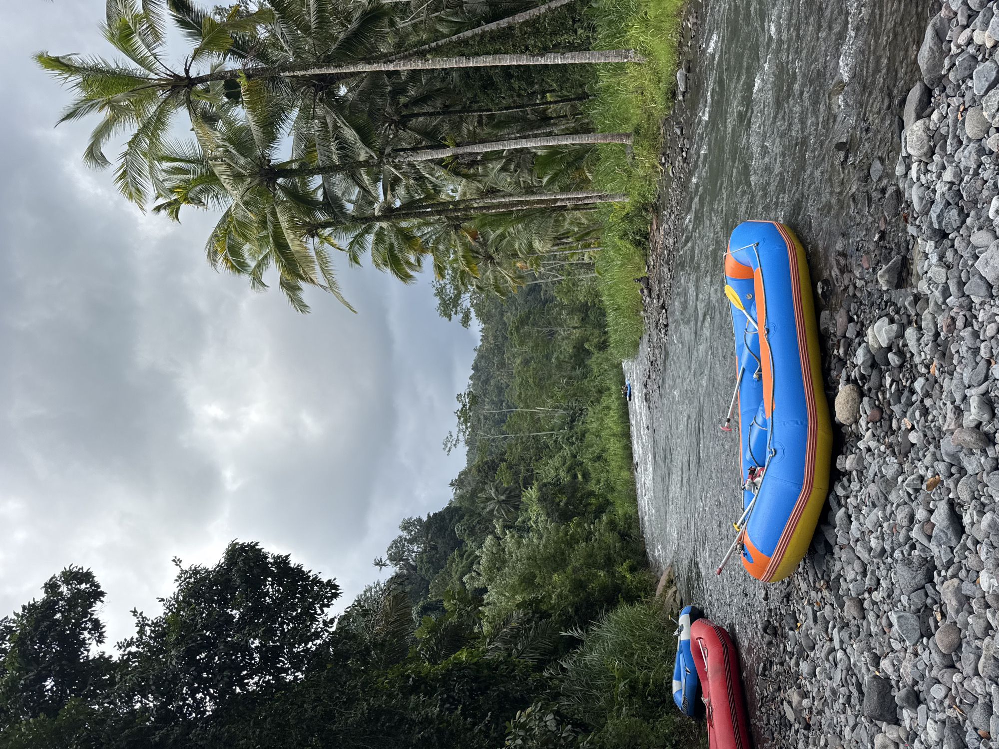 River rafting groups navigate shallow waters in Sidemen Indonesia