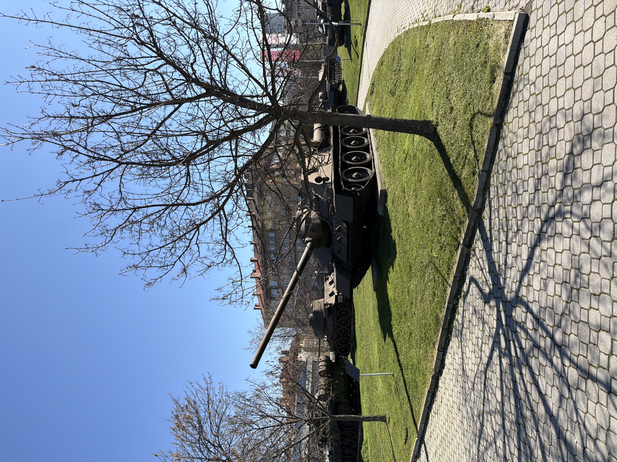 Military museum displays tanks and fighter jet outdoors