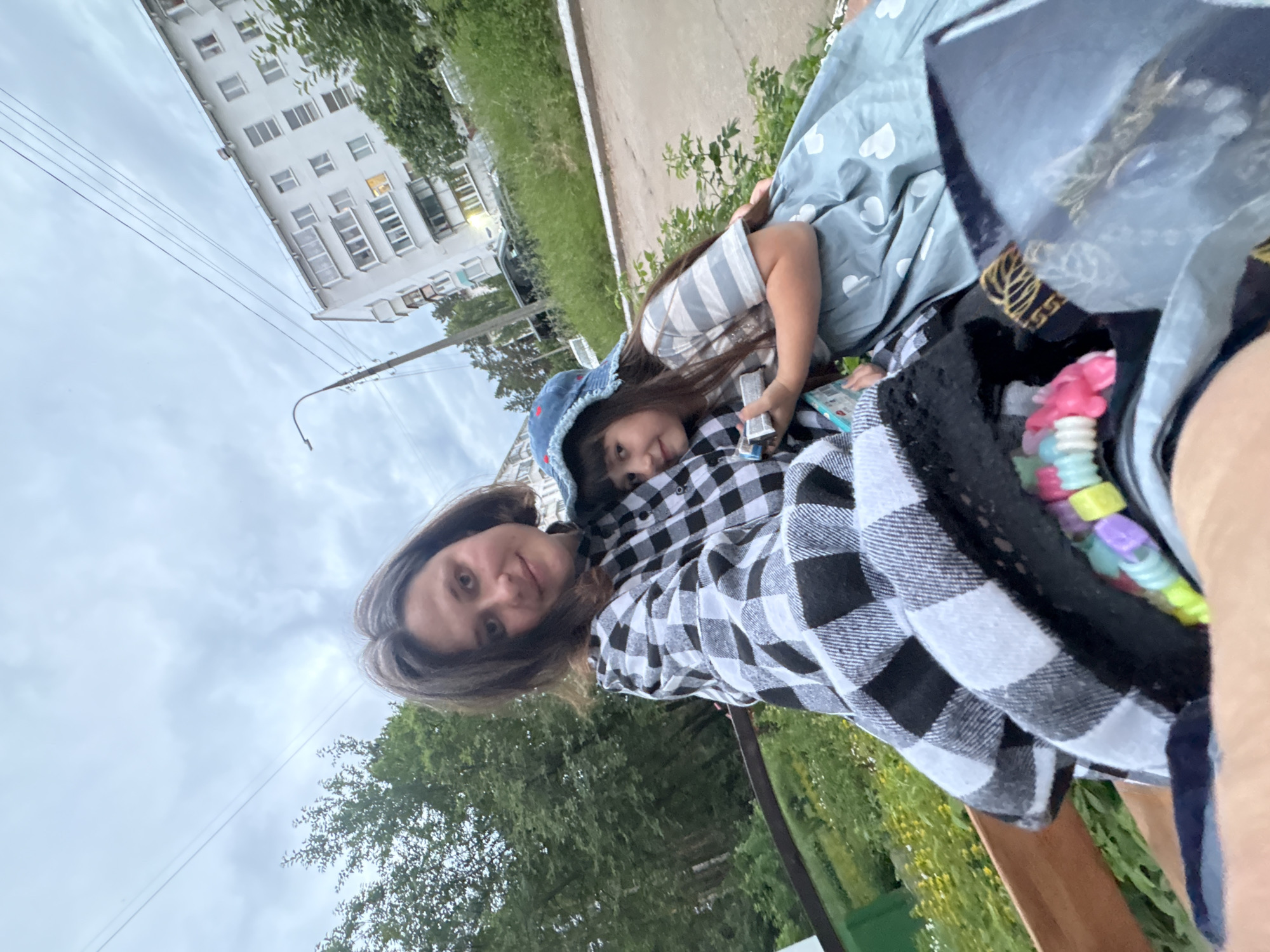 Mother, daughter spend afternoon together in urban neighborhood
