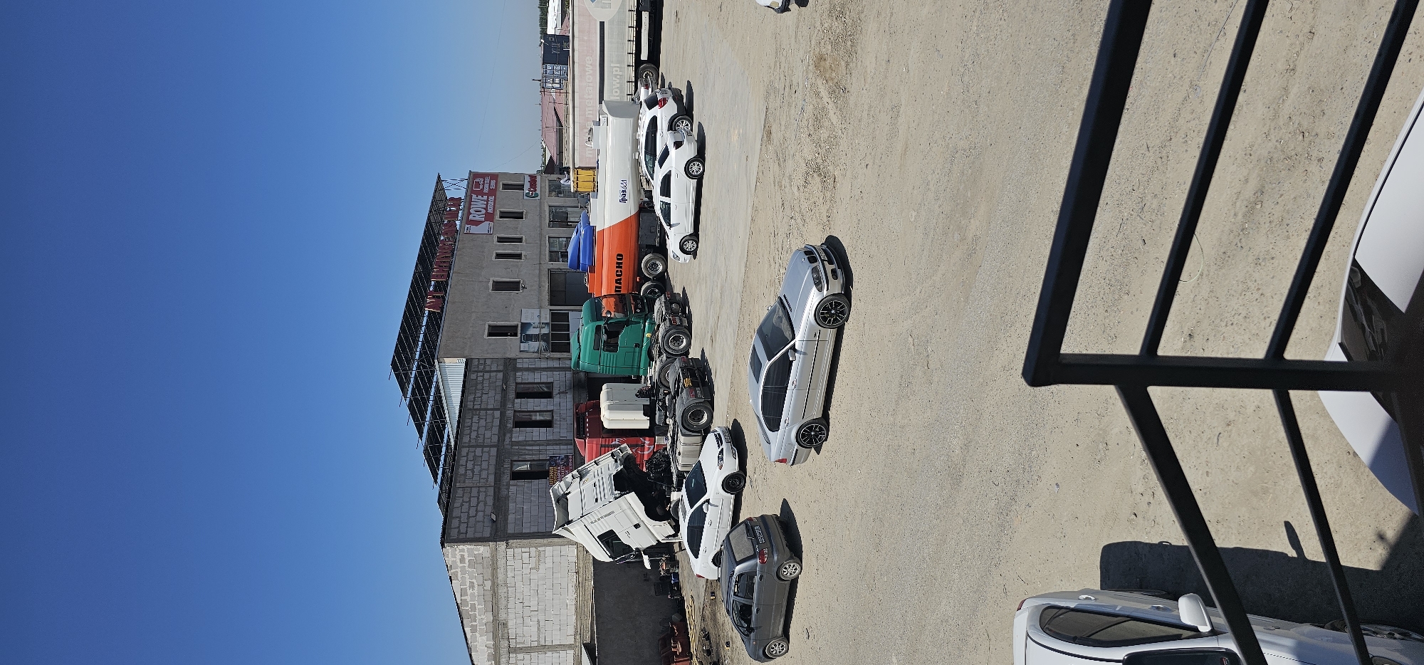 Truck yard activity and street scenes in Sheyhancha, Uzbekistan