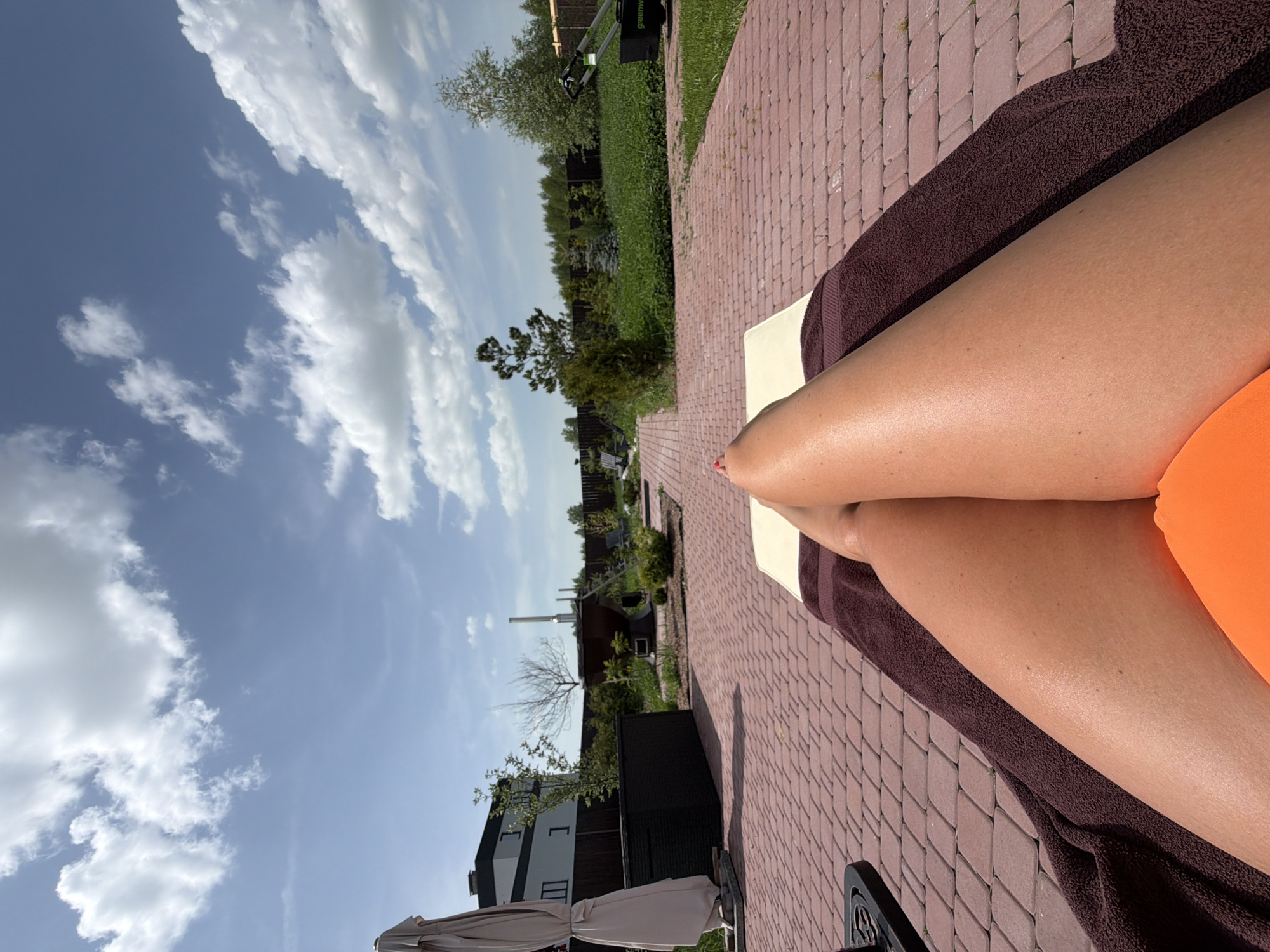 Resident sunbathes on patio in Ryazan during morning hours