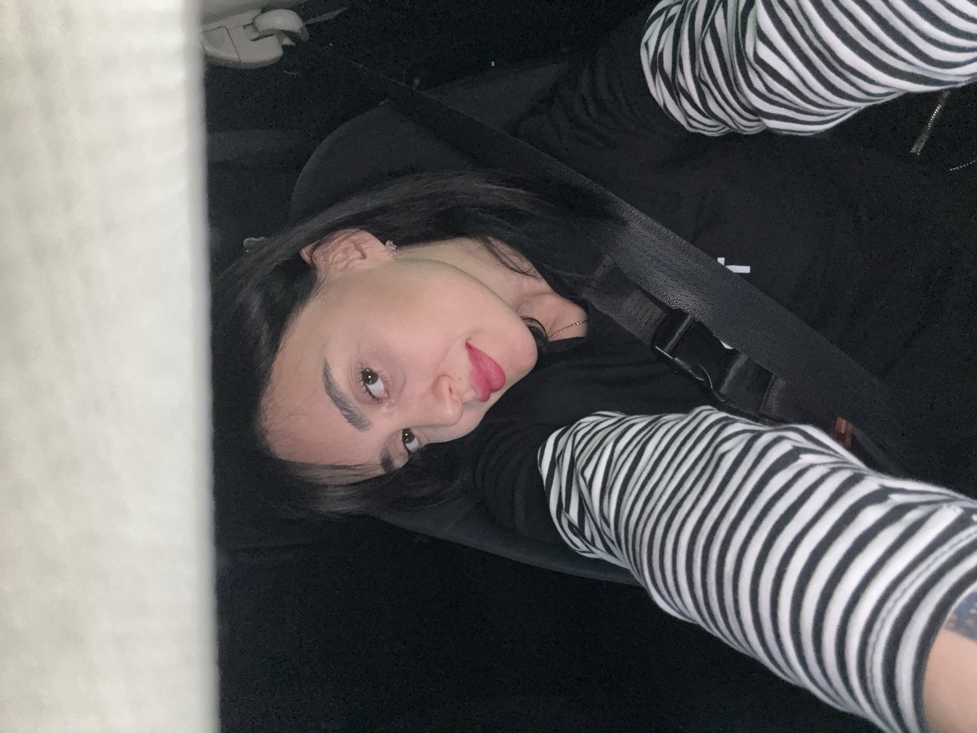 Woman photographed in car passenger seat in Tbilisi