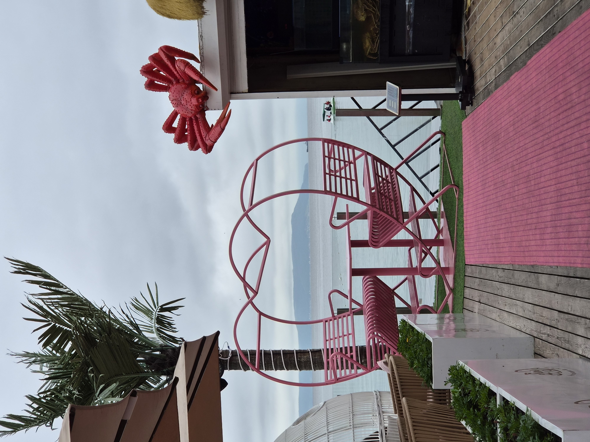 Vladivostok waterfront: cafes, harbor, streets, and sea on a cloudy day