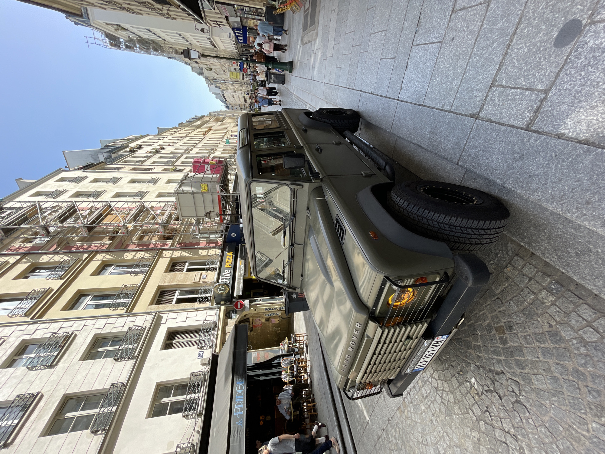 Ordinary street life captured in Paris neighborhood