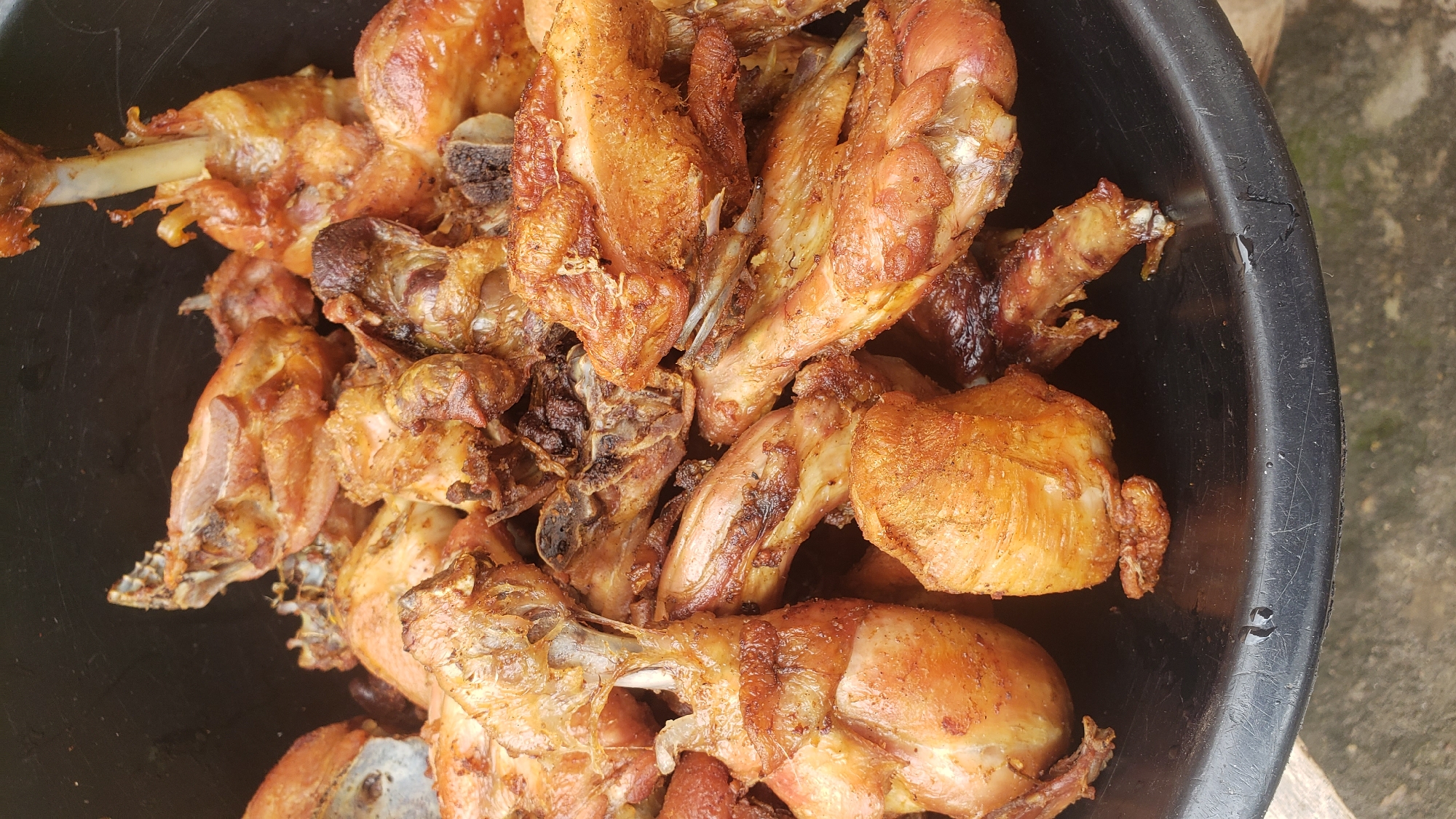 Big outdoor cook-up in Sabon Tasha: fire, rice, and fried chicken