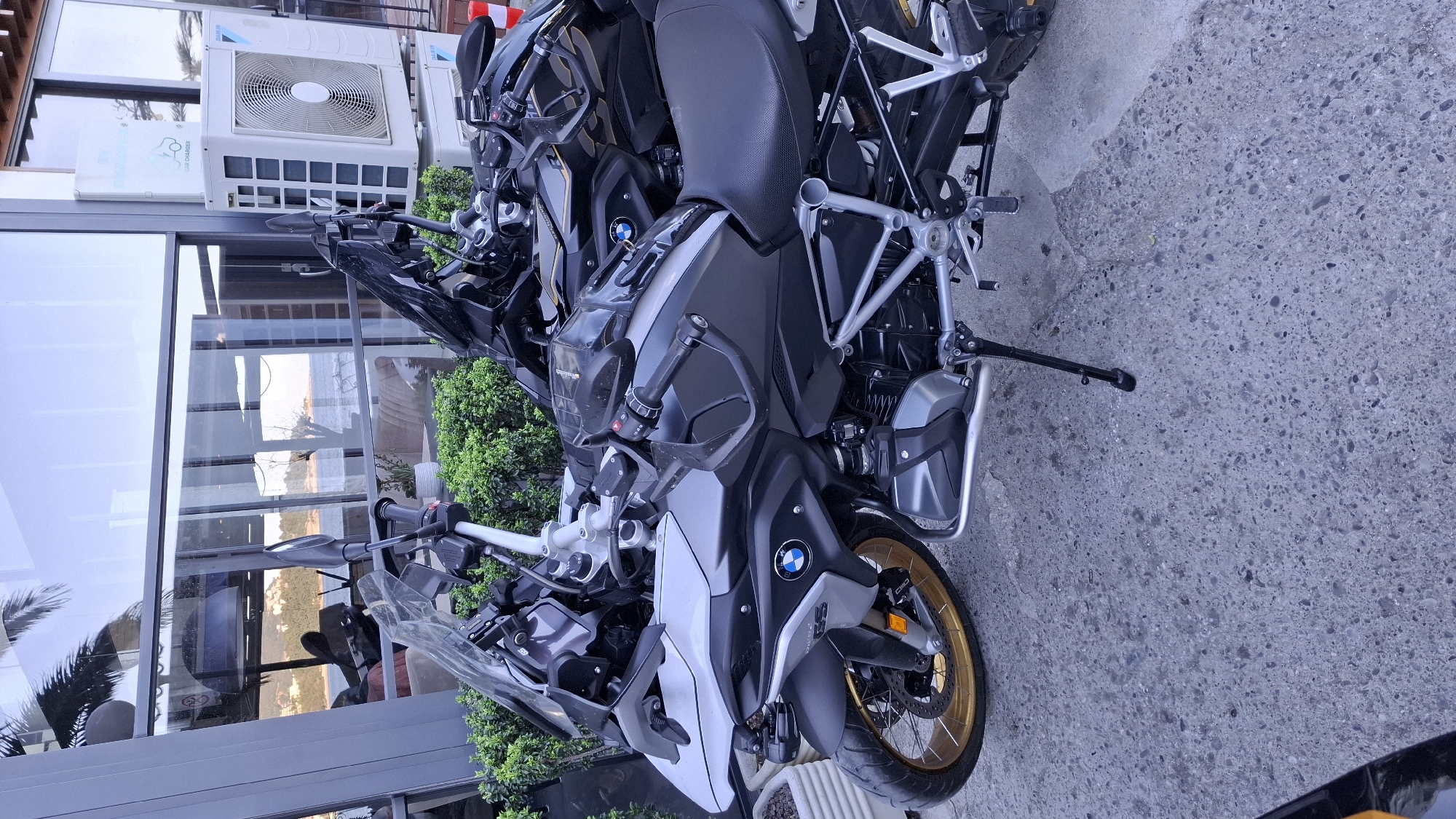 Two BMW motorcycles parked in coastal Montenegro town