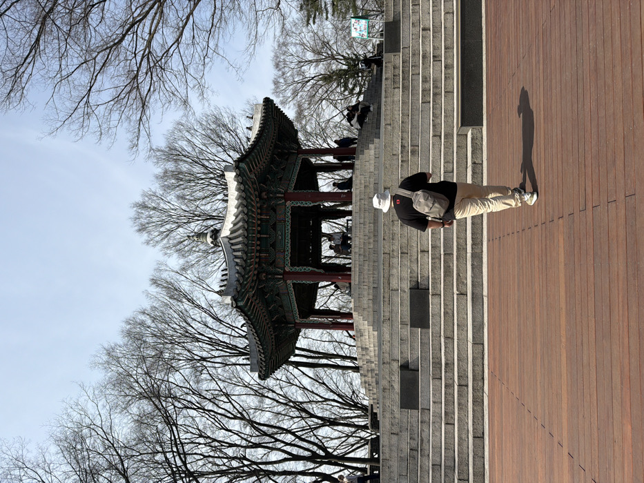 Tourist documents early morning Seoul attractions tour at Namsan Tower