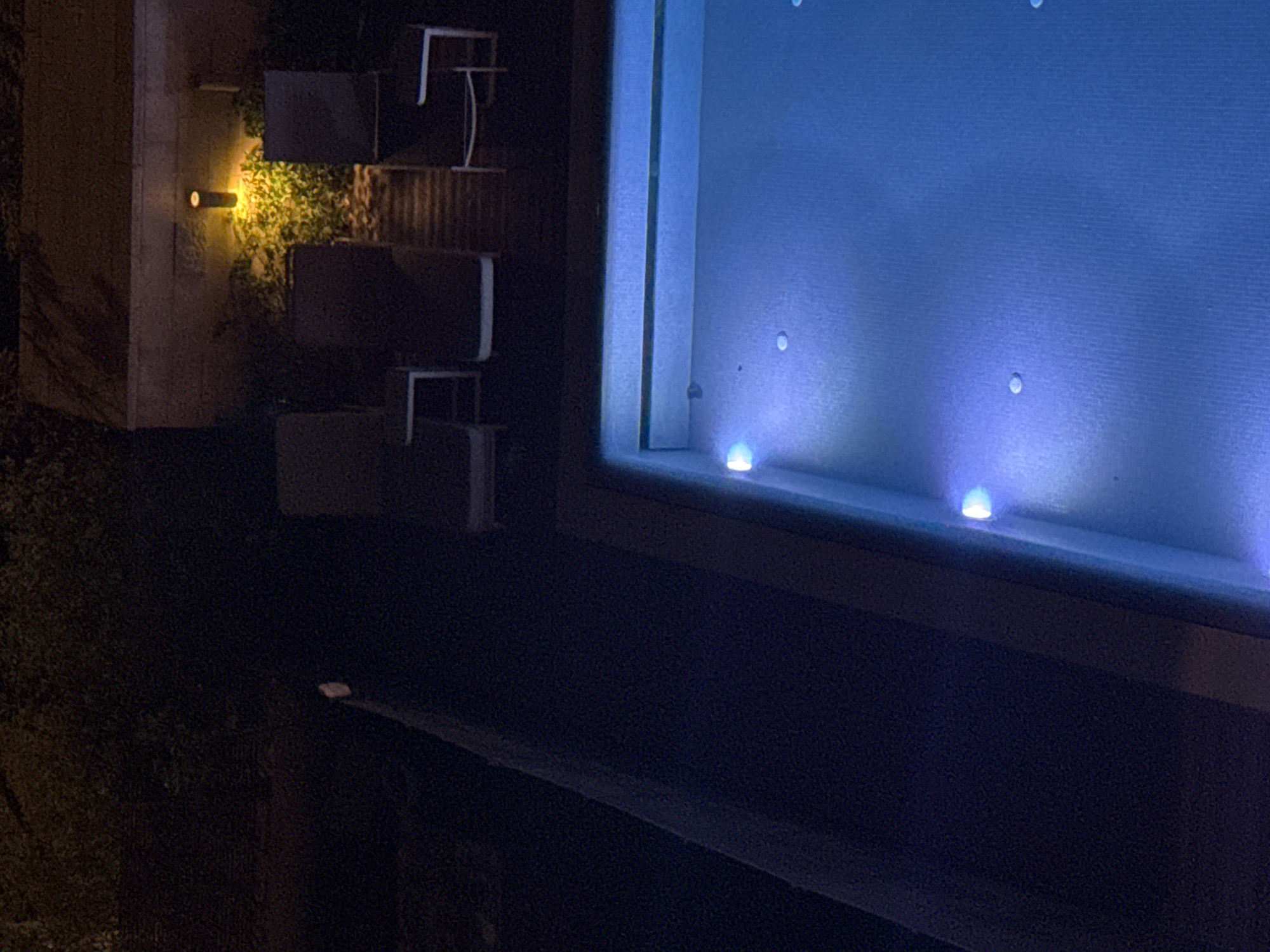 Blue-lit pool observed in Tel Aviv nighttime setting