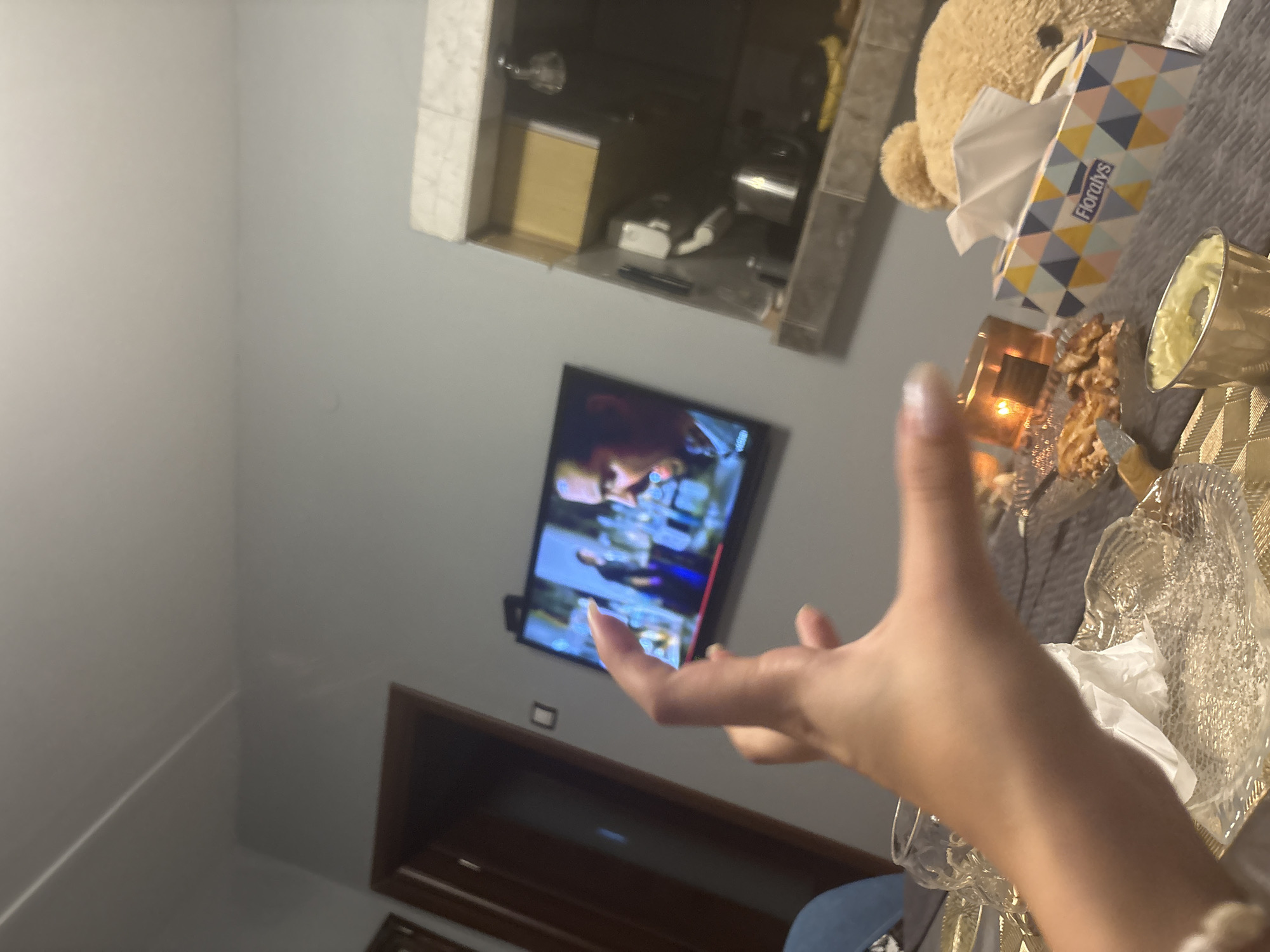 Indoor World Cup viewing party with selfies and personal items