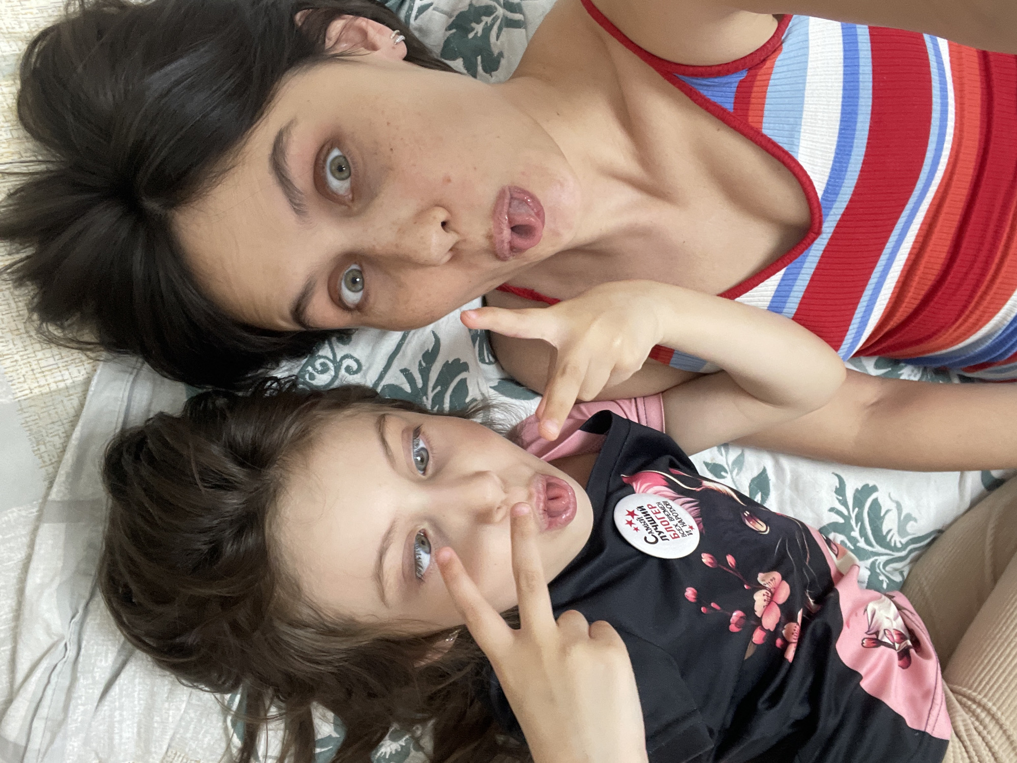Woman takes selfies with girl in Izhevsk apartment