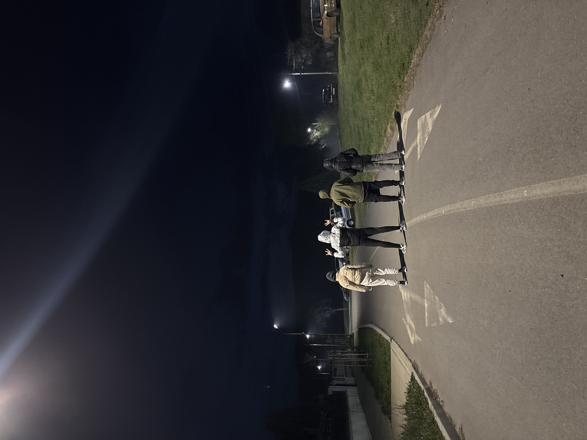 Four people stand on marked road in Zlatitsa, Bulgaria