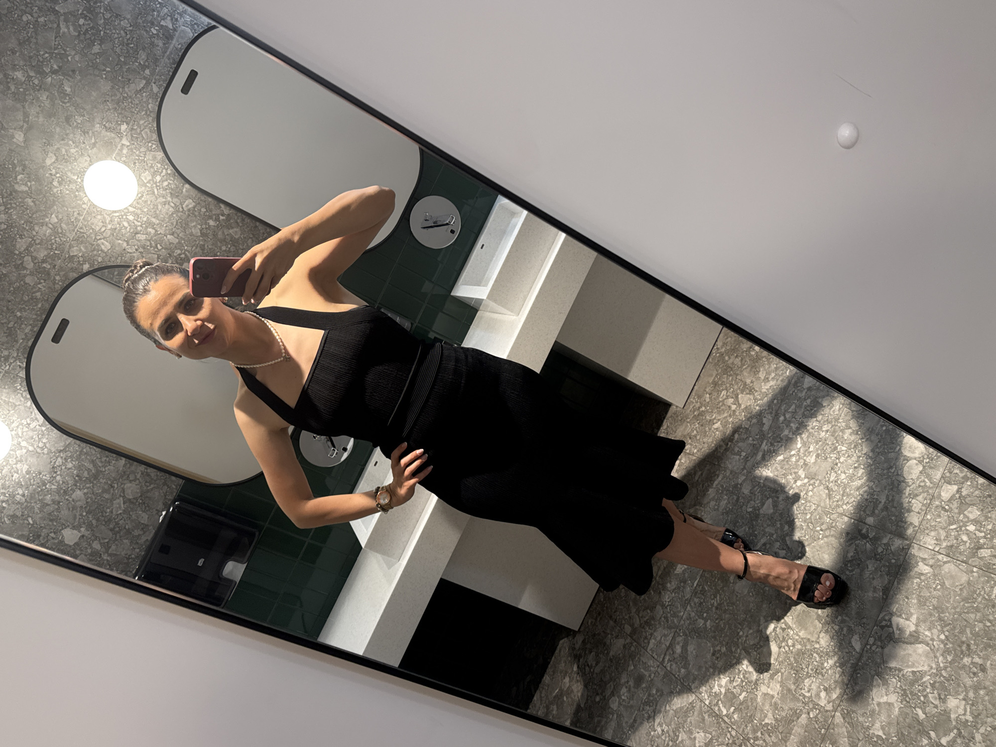 Woman Takes Selfie in Tivat Public Restroom