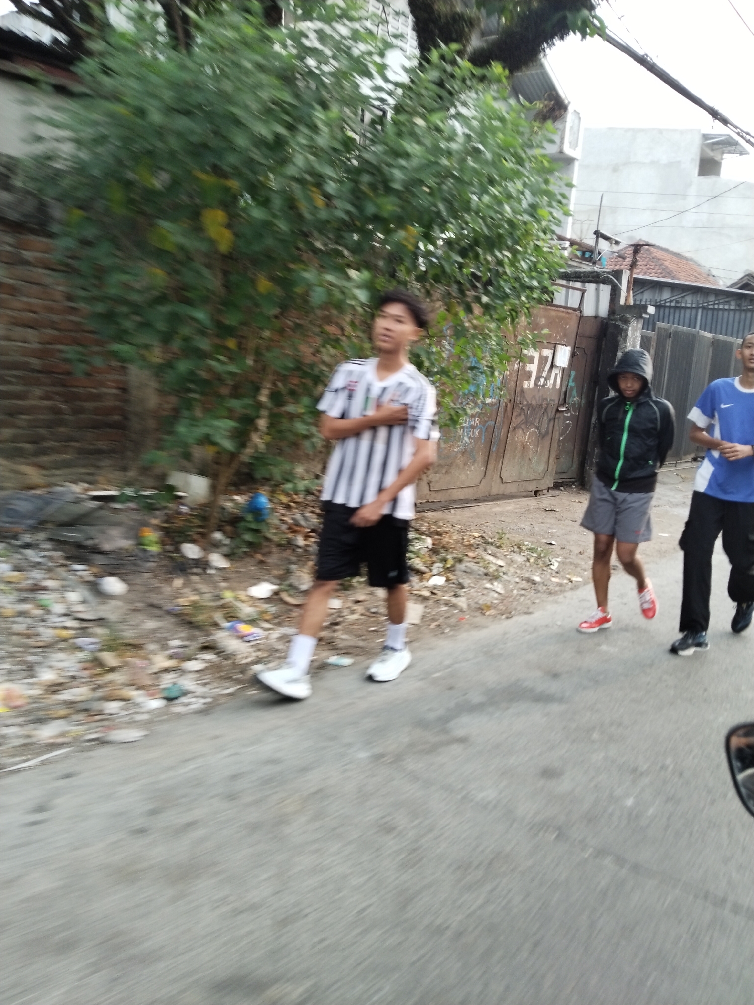 Everyday street life on a Bandung block, mid-morning
