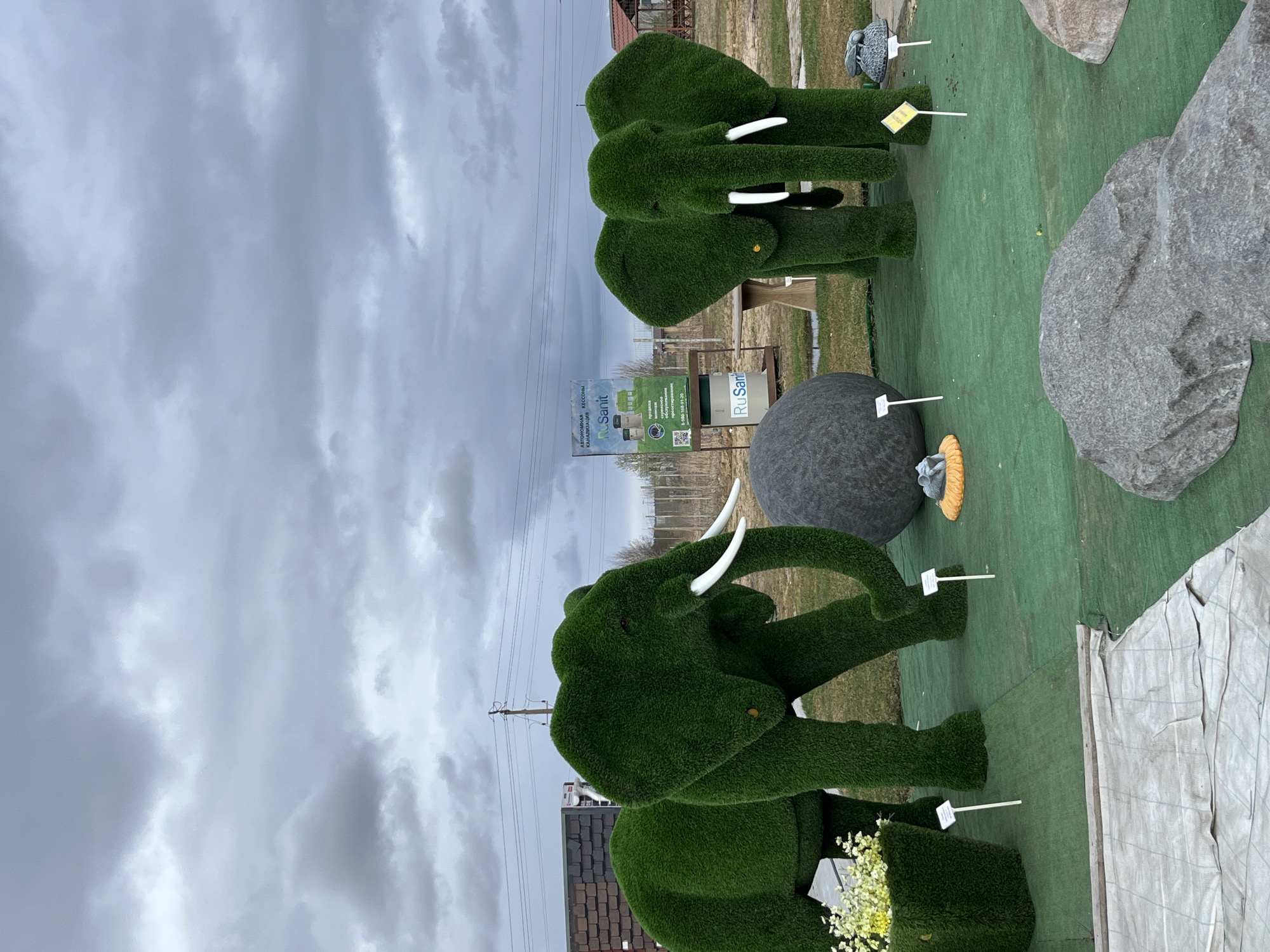 Decorative animal sculptures displayed in outdoor Bezborodovo garden setting
