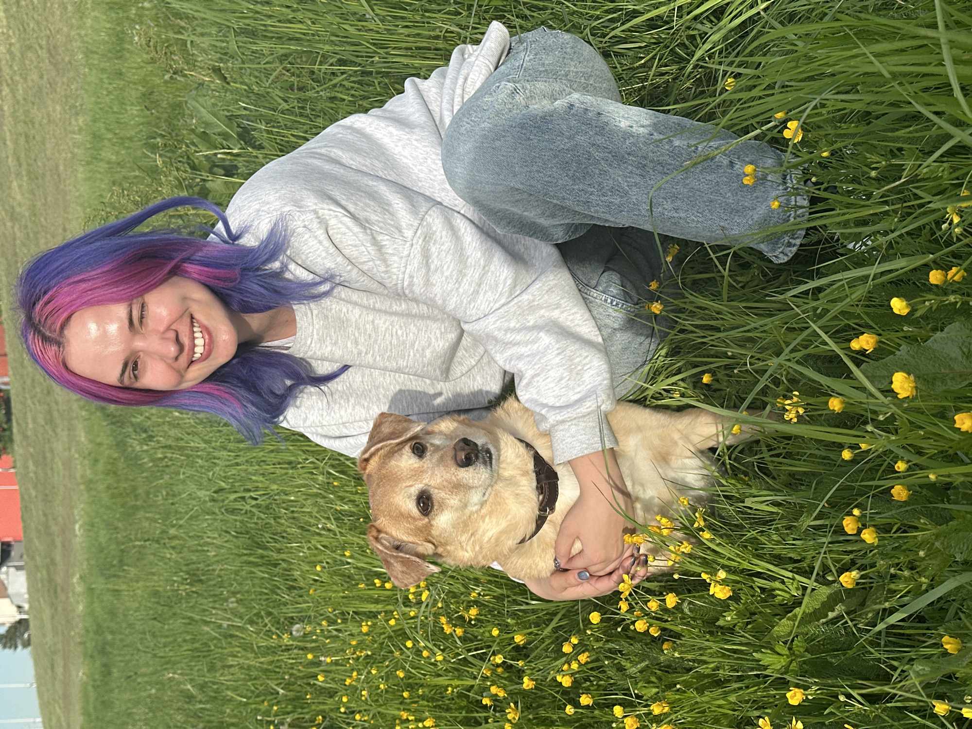 Woman enjoys sunny afternoon with dog in Zagreb field