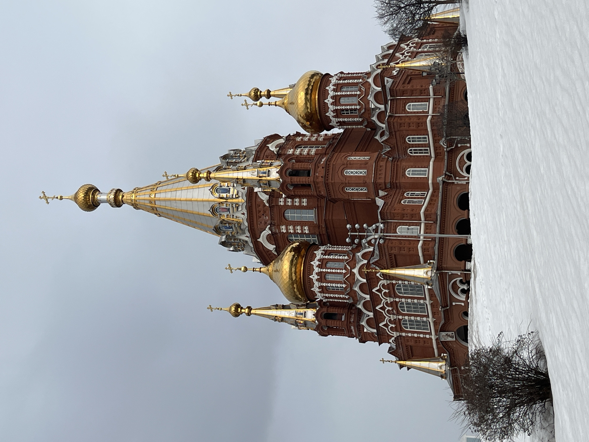 Woman takes selfies near St. Michael's Cathedral in Izhevsk