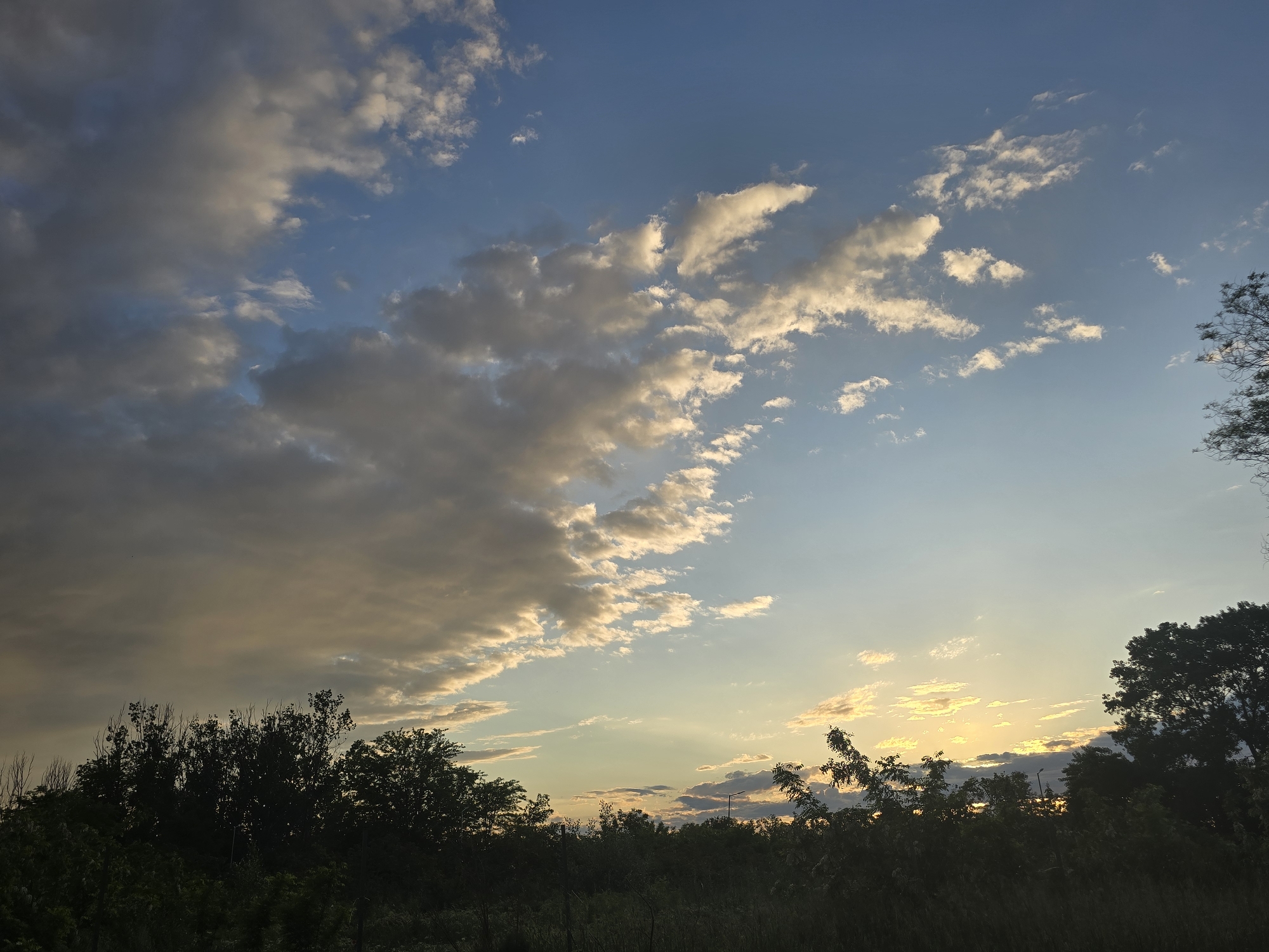 Witness documents sunset landscape with transitioning blue sky
