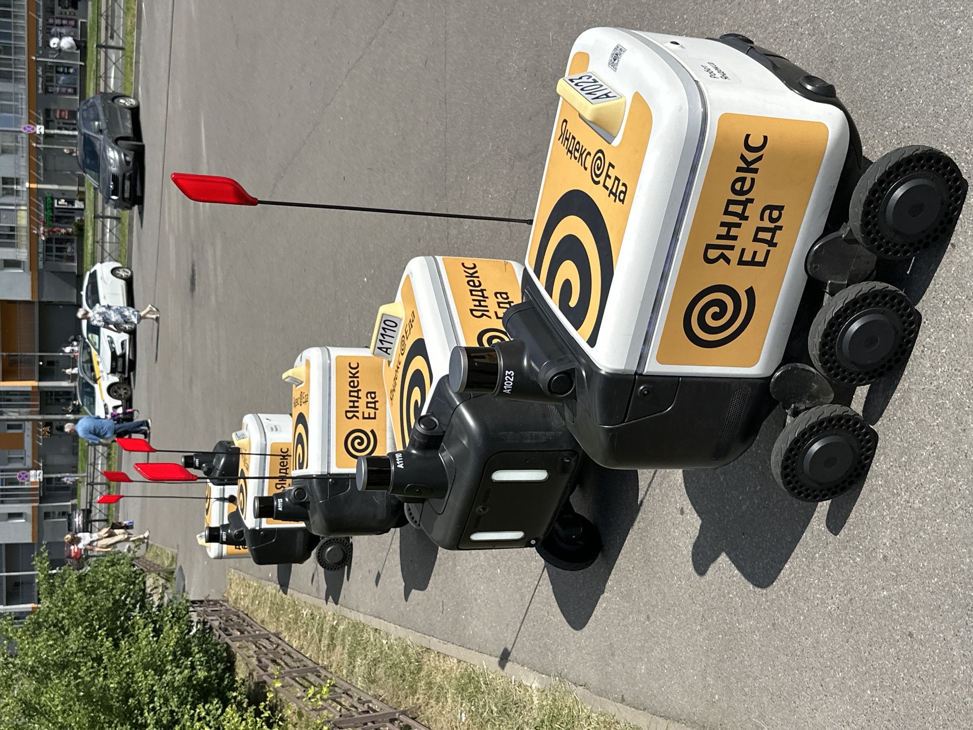 Yandex Food delivery robots parked in a row, Murino