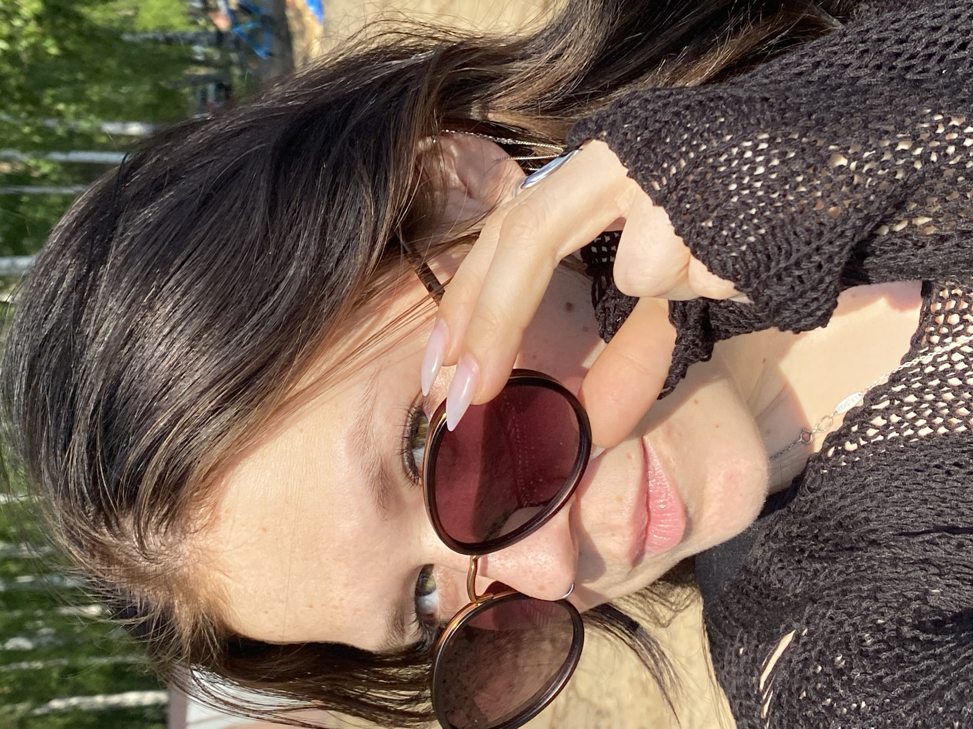 Woman photographed in outdoor portrait, car selfie in Chaikovsky